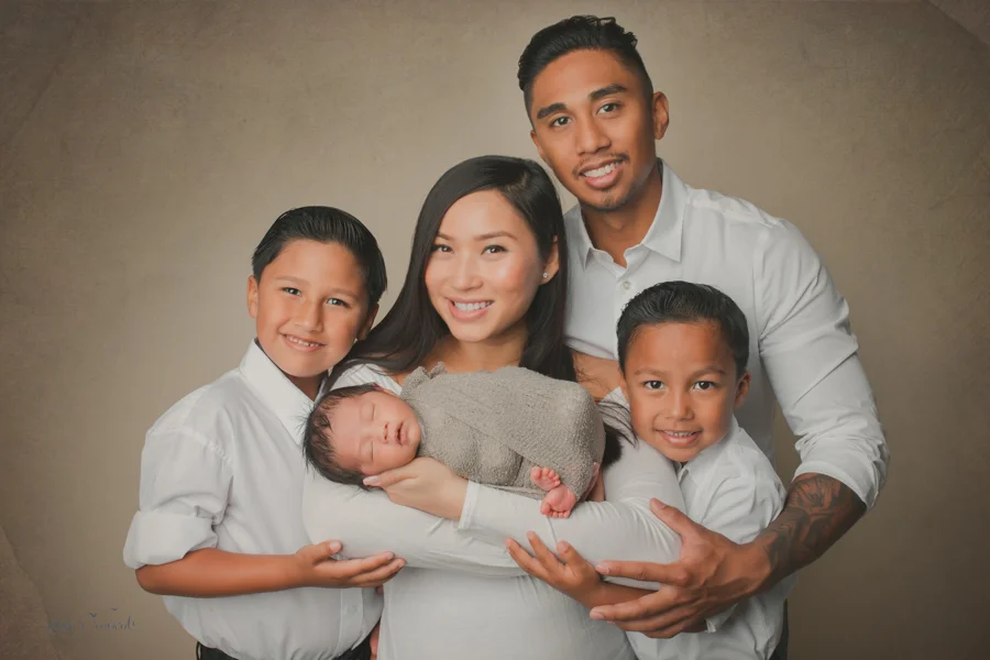 A family full of boys in this portrait celebrating the arrival of the third baby boy by Nature’s Reward Photography