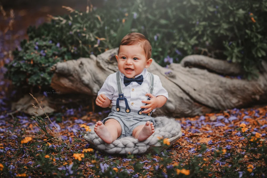 6 month old baby boy in his sitter session in a beautiful park, a portrait by Nature’s Reward Photography