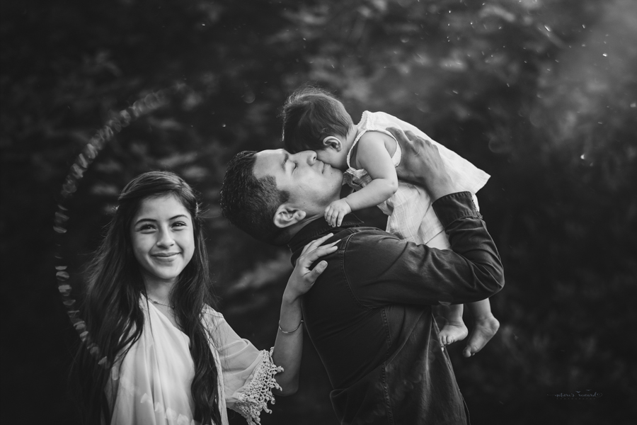 Dad and daughters portrait taken during a family session by Nature’s Reward Photography
