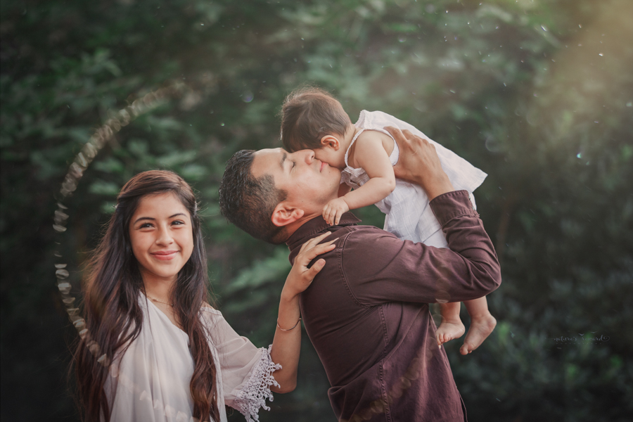 Dad and daughters portrait taken during a family session by Nature’s Reward Photography