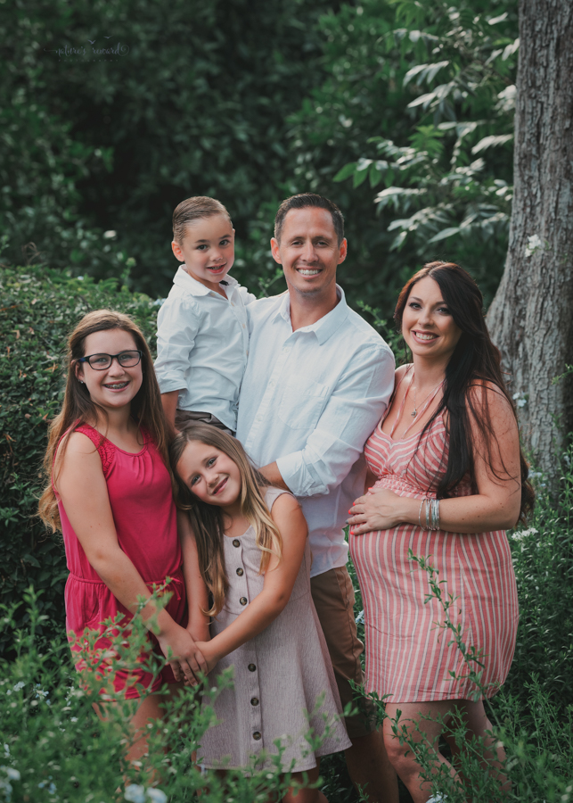 Beautiful family expecting a baby in this Maternity portrait by Nature’s Reward Photography