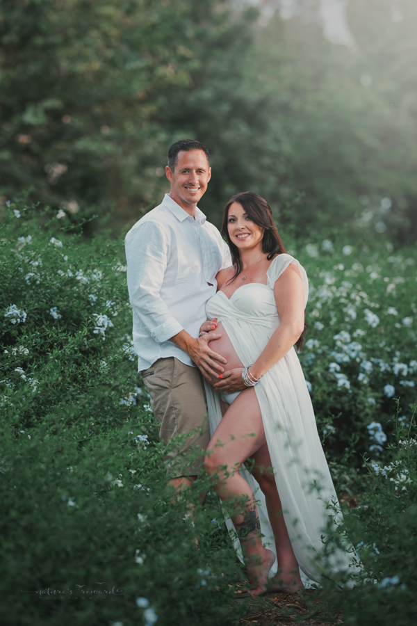 Loving couple expecting a baby in this maternity portrait by Nature’s Reward Photography
