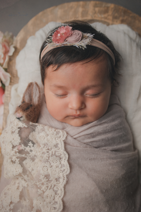 Newborn baby girl portrait by Nature’s Reward Photography