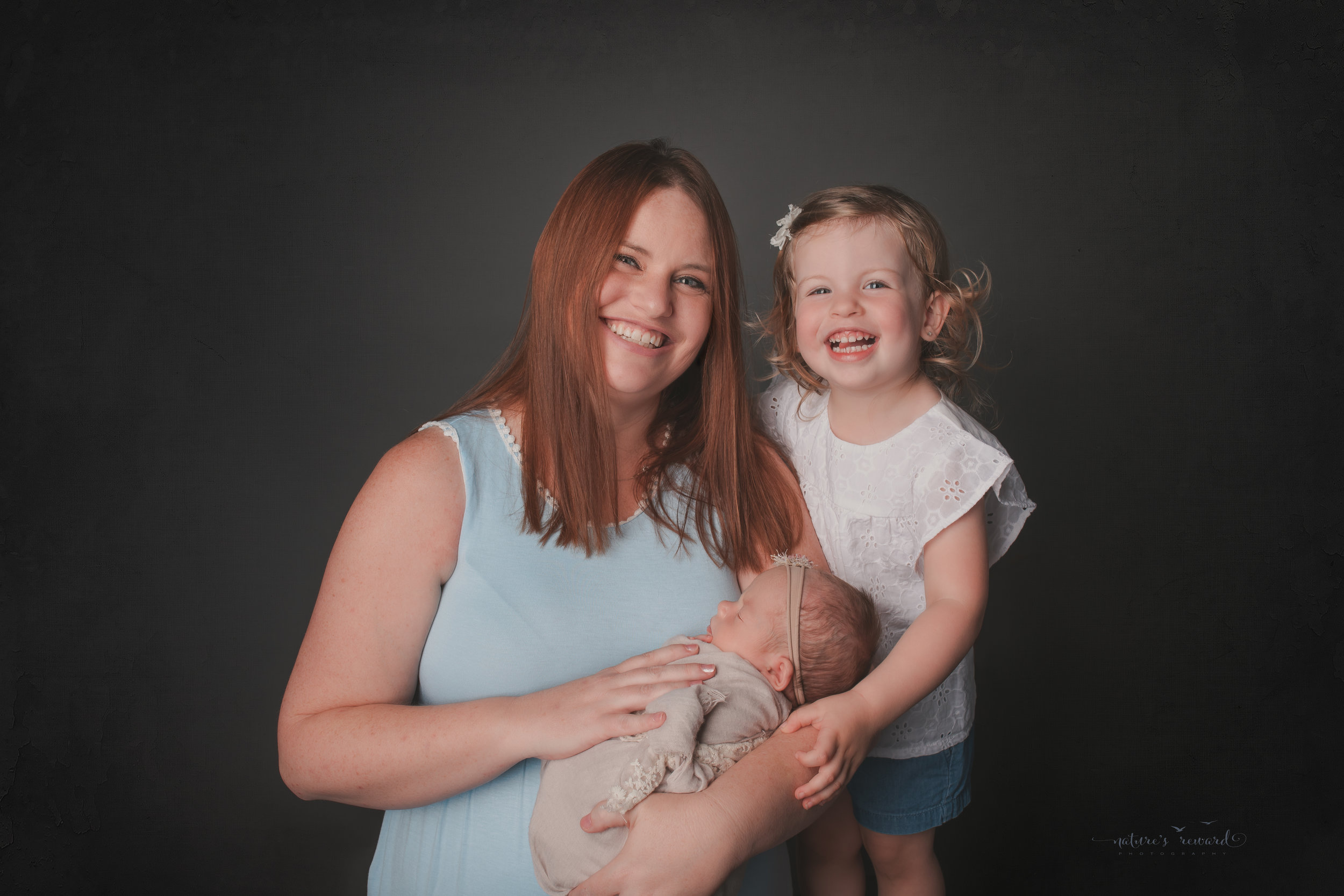 Mom and her daughters, , a newborn portrait by Nature's Reward Photography