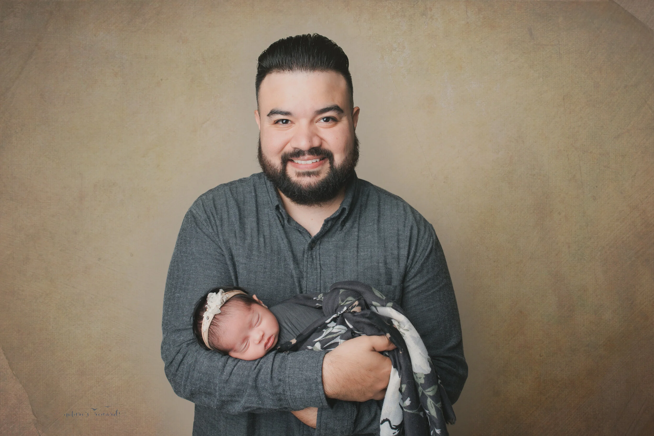 With dad, a newborn portrait by Nature’s Reward Photography