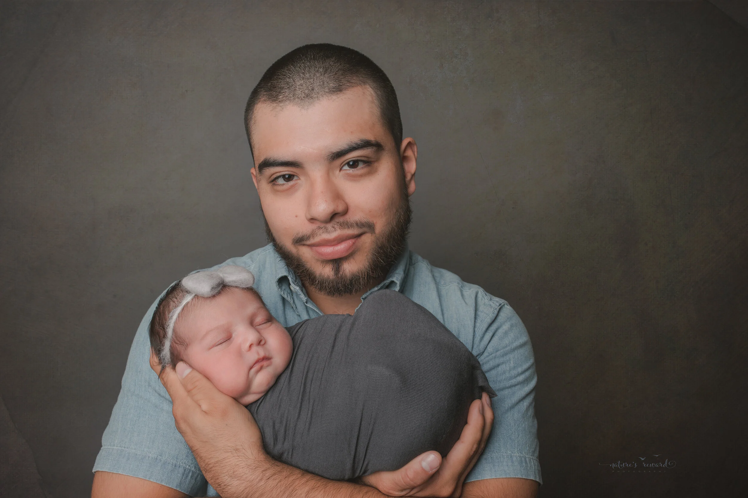 With dad, a newborn Portrait by Nature’s Reward Photography