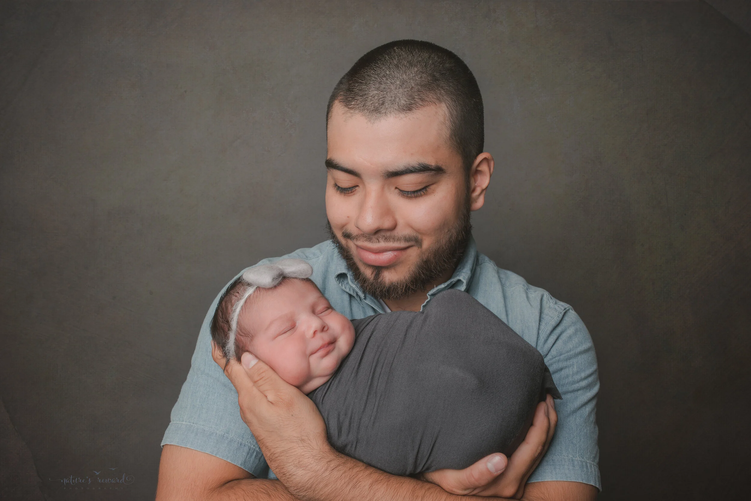 With dad, a newborn Portrait by Nature’s Reward Photography
