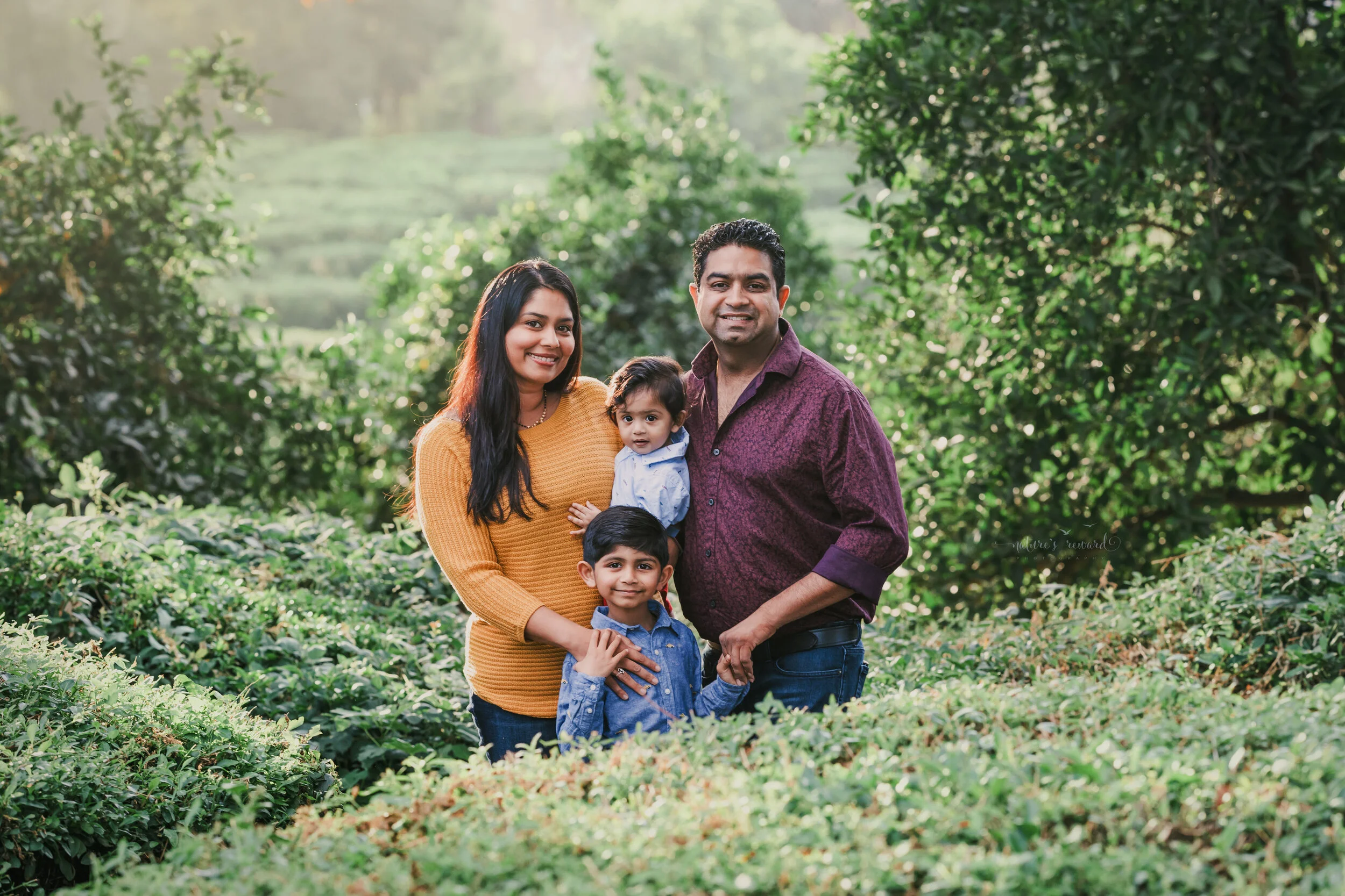 Fall Family portrait in a lush green park in redlands California, by San Bernardino photographer, Nature’s Reward Photography.