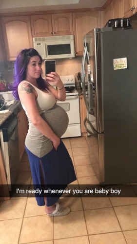 feeling huge at 39 weeks! You can see in the background the hypnobirthing scripts that I had posted all over the house.