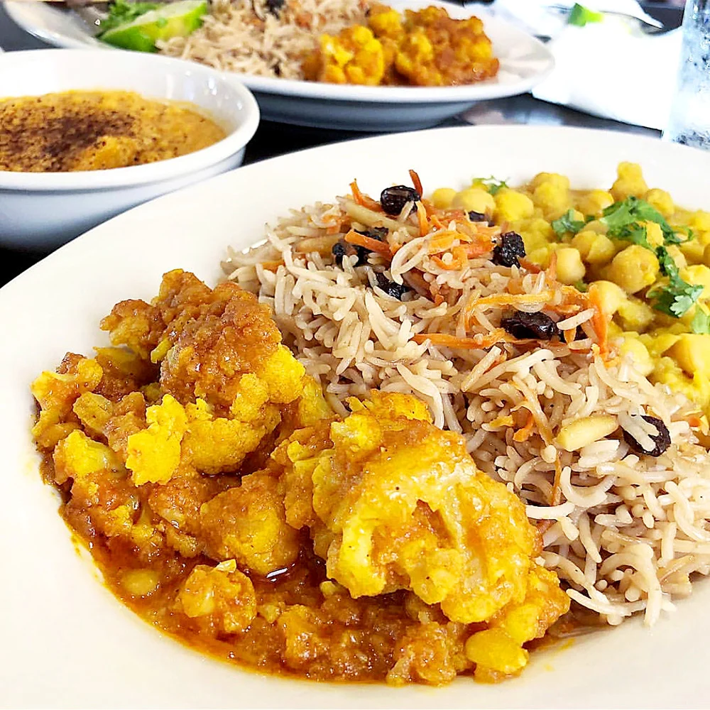   Aryana Afghan Cuisine    (Image: veggie plate)  If you’re both feeling adventurous, Aryana is an amazing choice. Located in downtown Greenville, this Afghan restaurant offers delicious options. Their menu is simple and easy to navigate, with clear 
