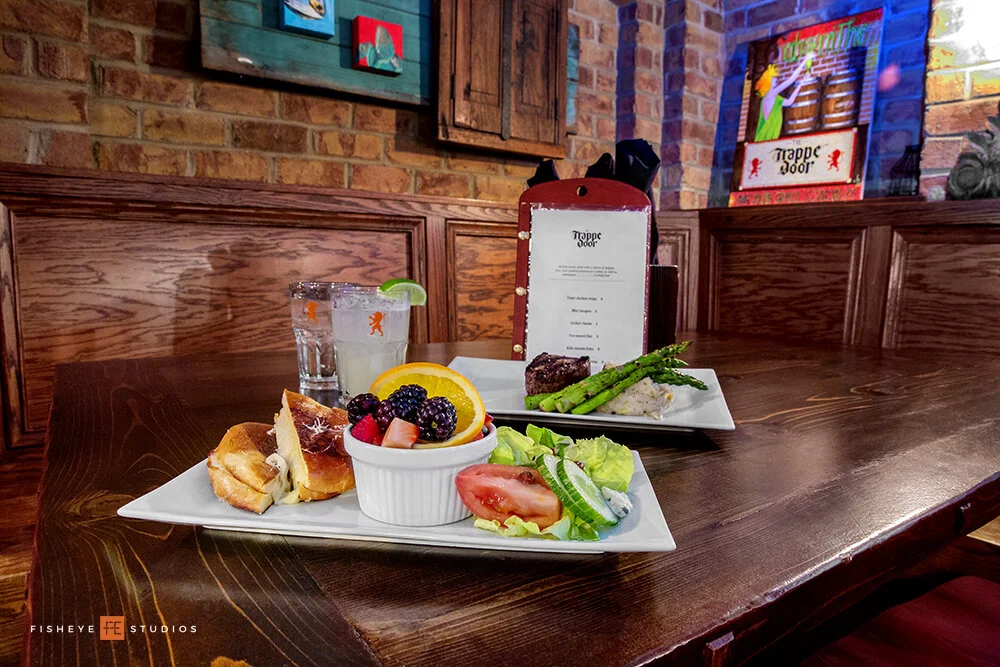    Trappe Door    Trappe Door is truly a Greenville staple. For us, it checks all the boxes: unique and authentic food, Belgium-style beer options and original cocktails, cavelike ambiance, and affordable prices. Their pork and cherry sausages with m