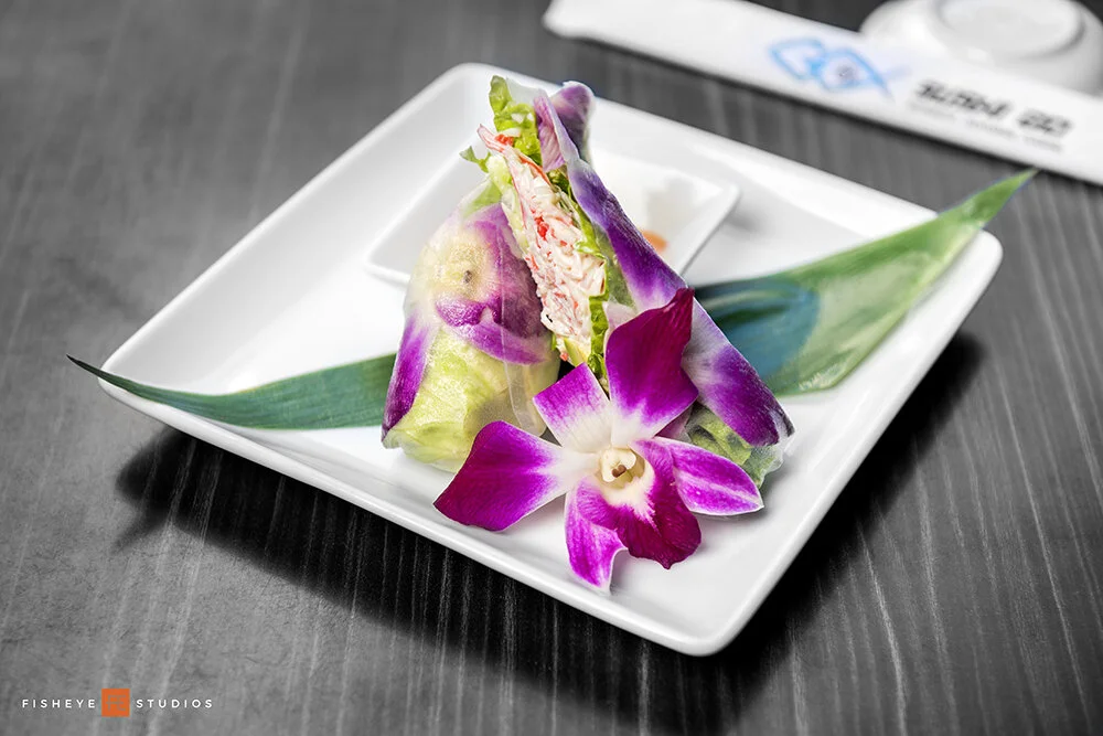  Flower harumaki: wrapped fresh spring roll with avocado, snow crab, cucumber and an edible flower. 