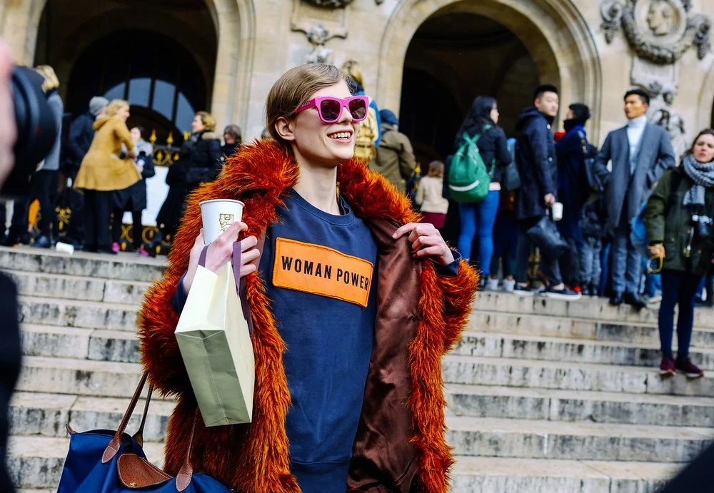 An Acne Studios sweatshirt, a Longchamp bag, and a Stella McCartney sunglasses, image by Phil Oh , Paris Fashion Week 2016.