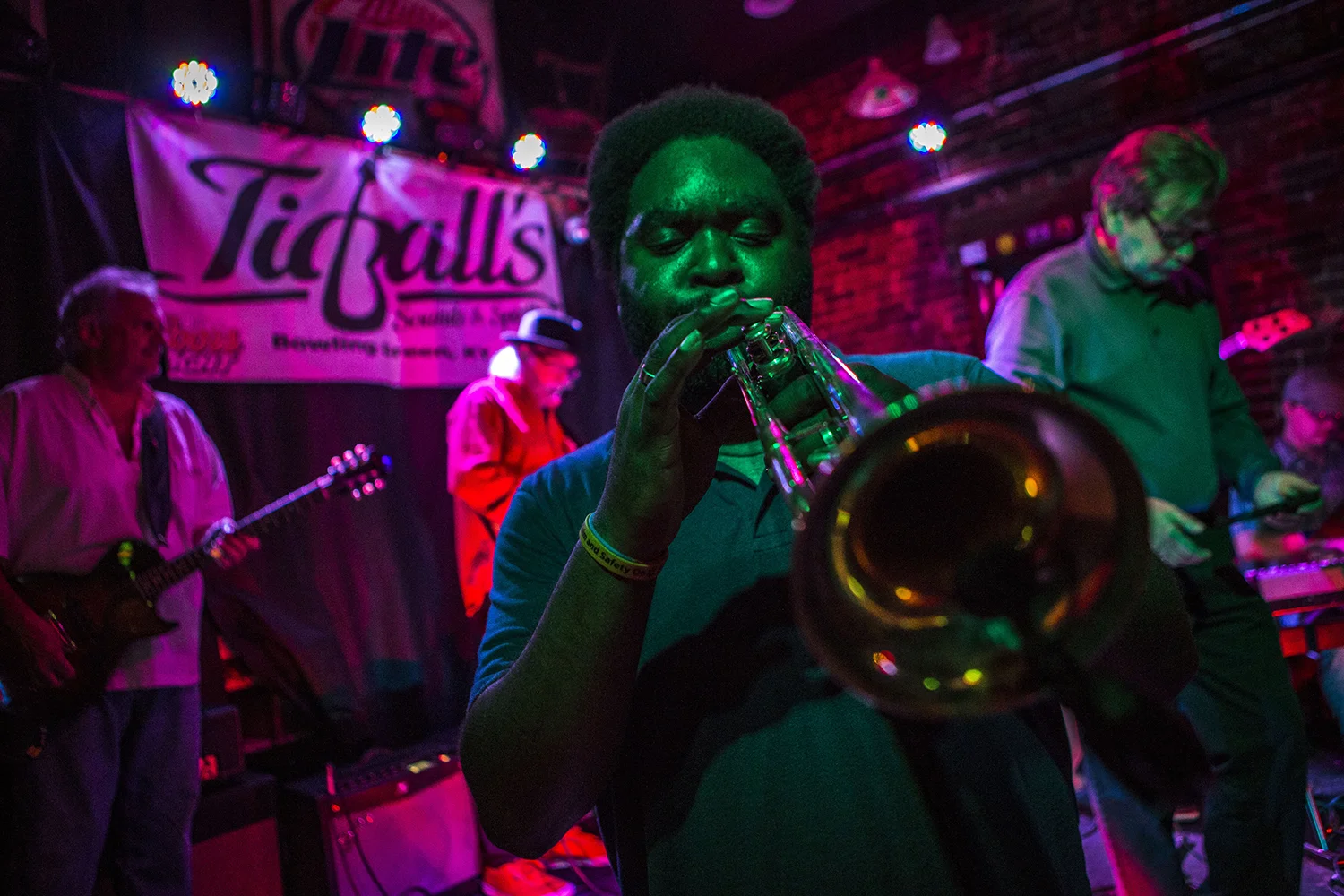  Trumpet player Kevin Goodnight practices as he has his portrait taken during KY Blues Jam. Every Sunday night blues and music enthusiasts come together together to jam and improv music together. "It's like Garage band with adults." Said Goodnight. 
