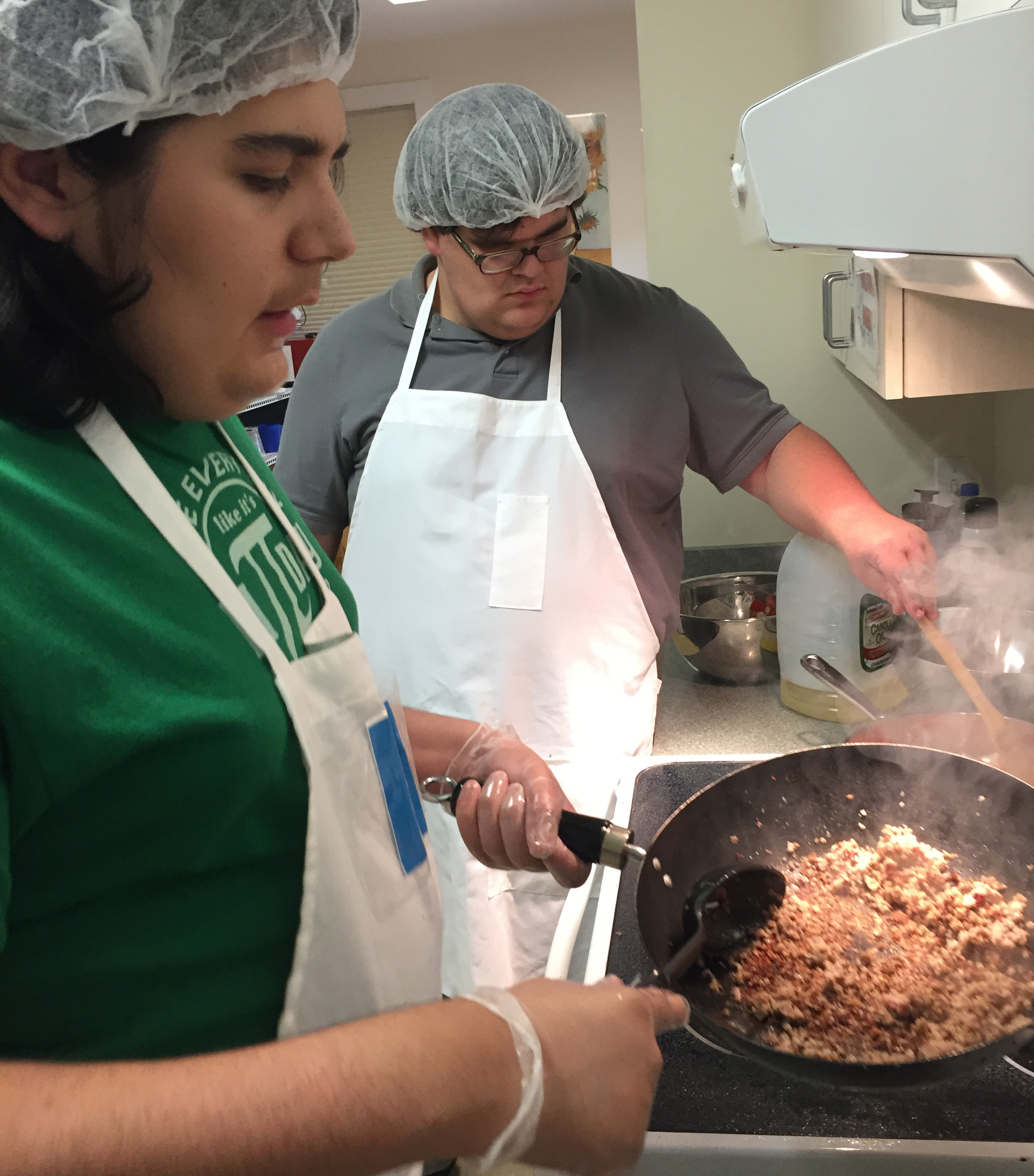 Gray serves TA Ren at Harvey Relief fundraising breakfast