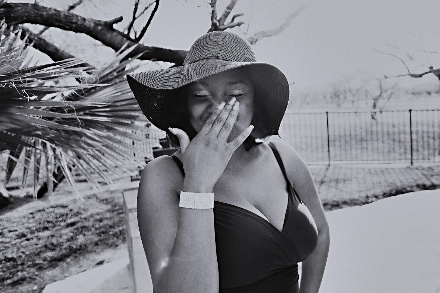  beautiful curvy and plus size women of color laughing in the sun. boudoir by the pool.  