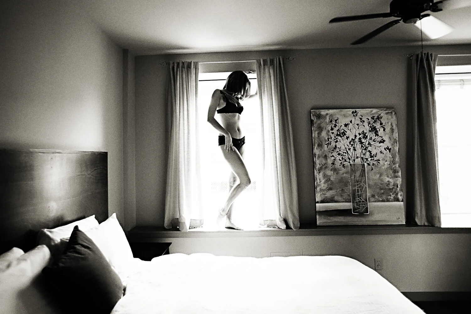  Full body boudoir silhouette in window. Sexy photoshoot in black lingerie at the V Boutique Hotel in Corpus Christi.   