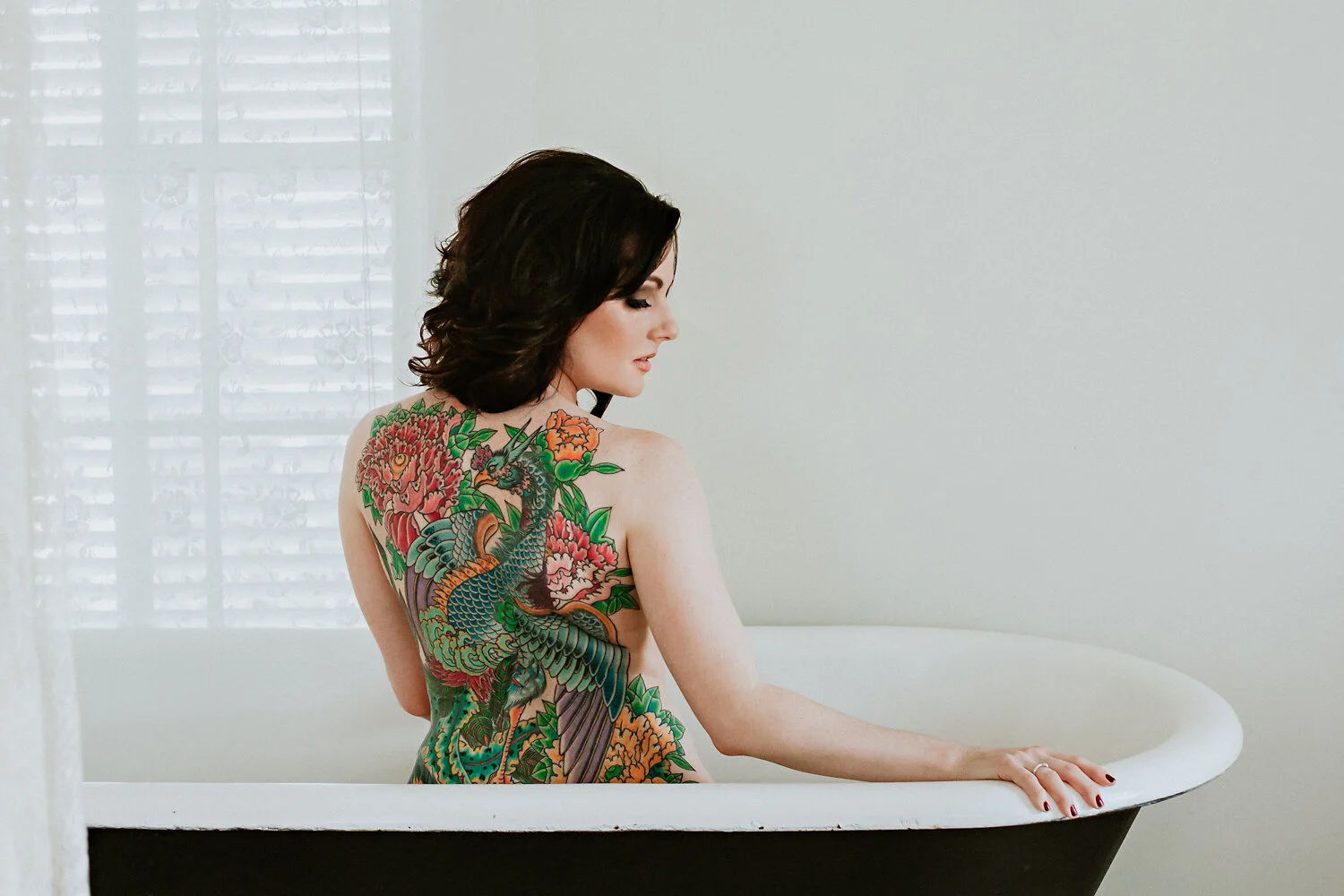  Boudoir in black and white clawfoot vintage tub at the  Tarpon Inn Corpus Christi  . Full colorful back tattoo.  