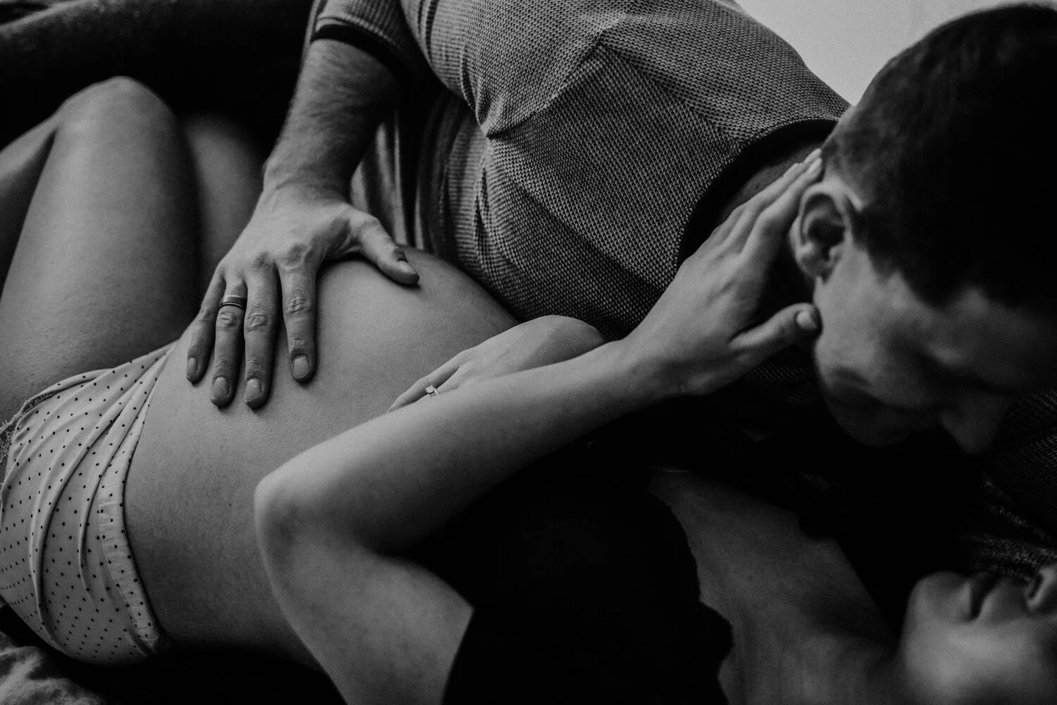  Couple maternity boudoir. Warm and intimate with pregnant belly and sexy pajamas.  