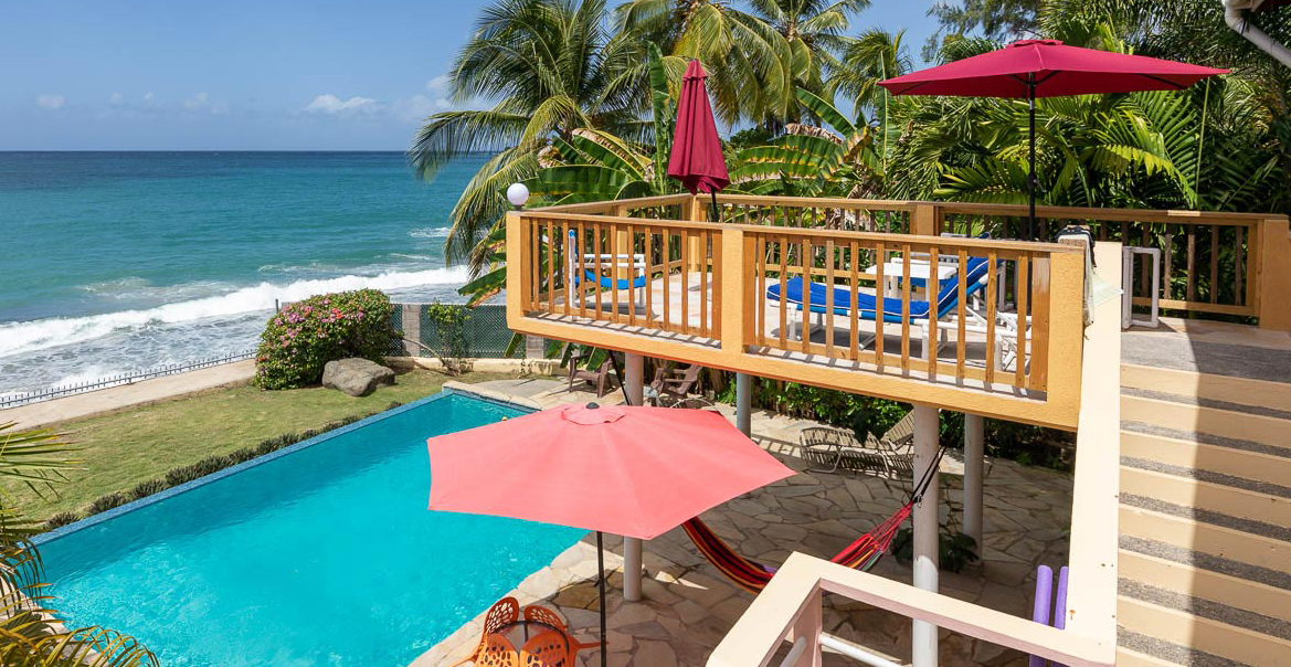 Birdie's Nest beach house sits on the shoreline, facing a beach along Great Courtland Bay in Black Rock, Tobago. It is perched on a slight slope and enjoys a clear, cool, elevated view of the ocean.