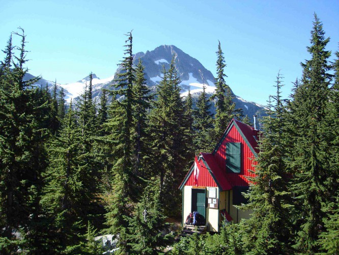 Tantalus Hut (Lake Lovely Water): Located at the outflow end of Lake Lovely Water, Tantalus Hut sits in a remote location at 3,850ft in the trees. The hut is a two-story wooden structure with a large kitchen / dining room on the main floor and a sleeping loft with foam mattresses for 20 people above. There is a dock nearby with two large rowboats and a canoe. Cost: $400 one way, $800 round trip - for up to 5 passengers Click Here to reserve the cabin