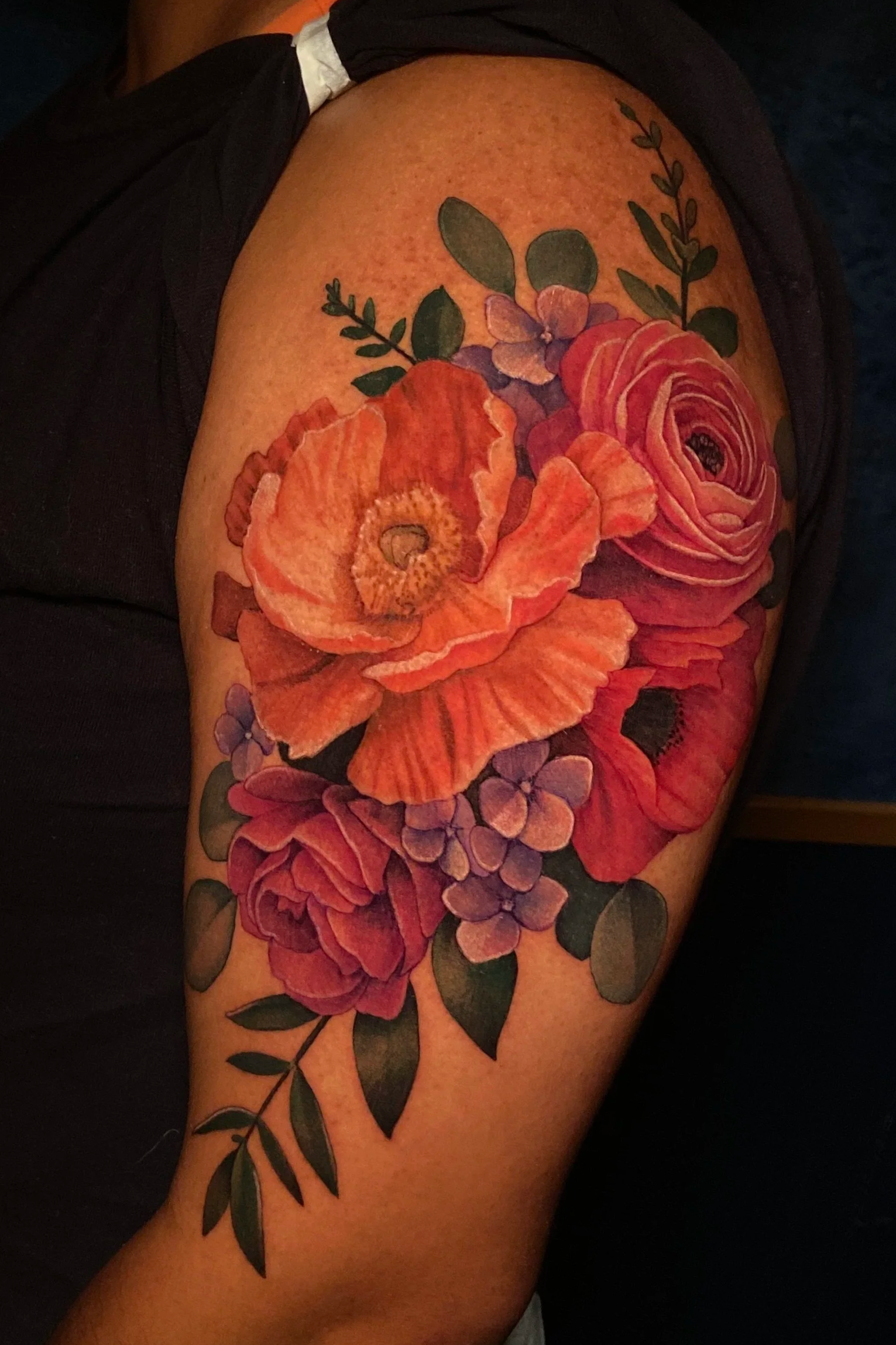 Adriana-hallow-tattoo-Melanated-skin-color-realism-nyc-orange-poppy-rununculus.png