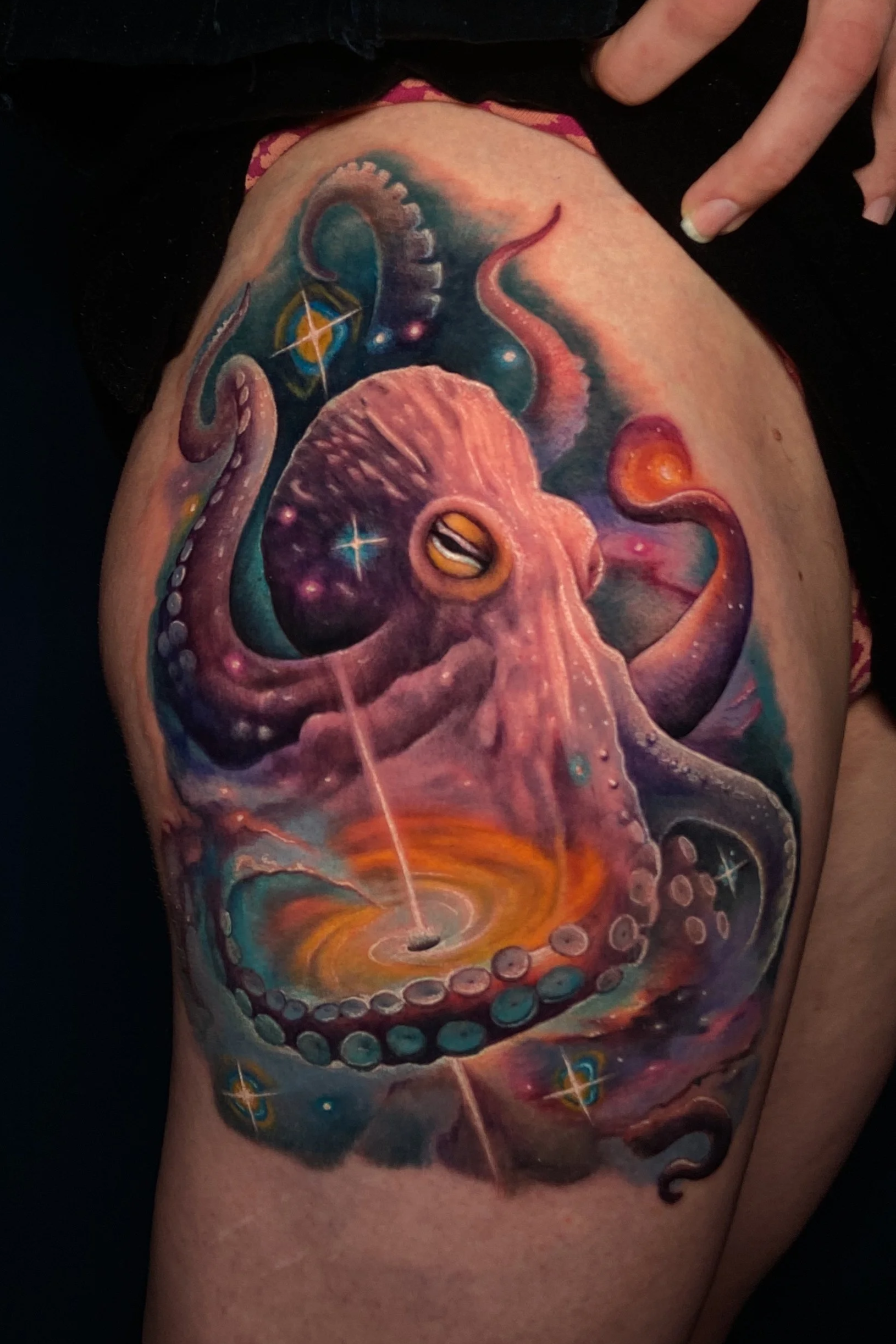 Adriana-hallow-tattoo-Melanated-skin-color-realism-nyc-octopus-galaxy-thigh.png