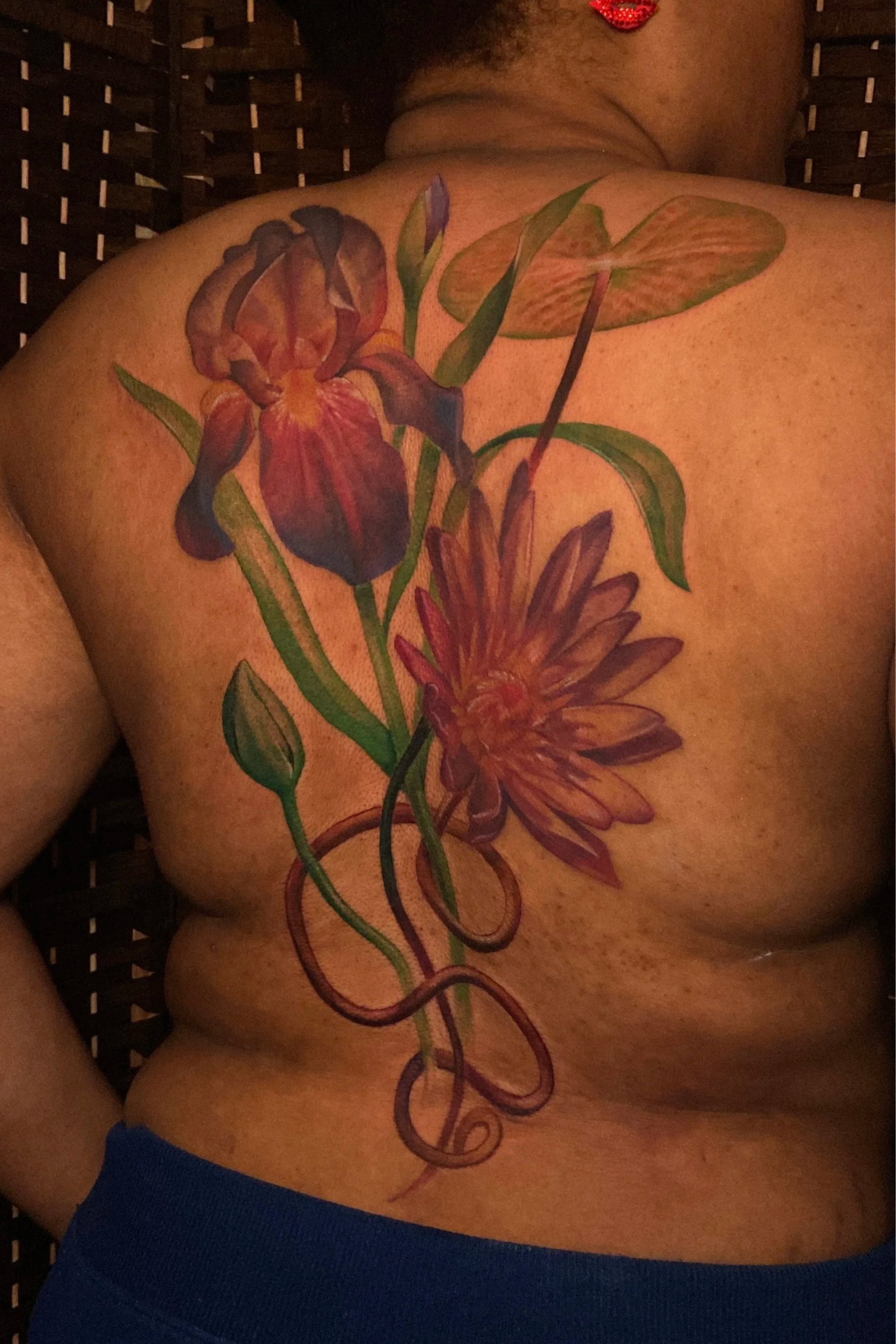 Adriana-hallow-tattoo-Melanated-skin-color-realism-nyc-lotus-iris-back-piece.png