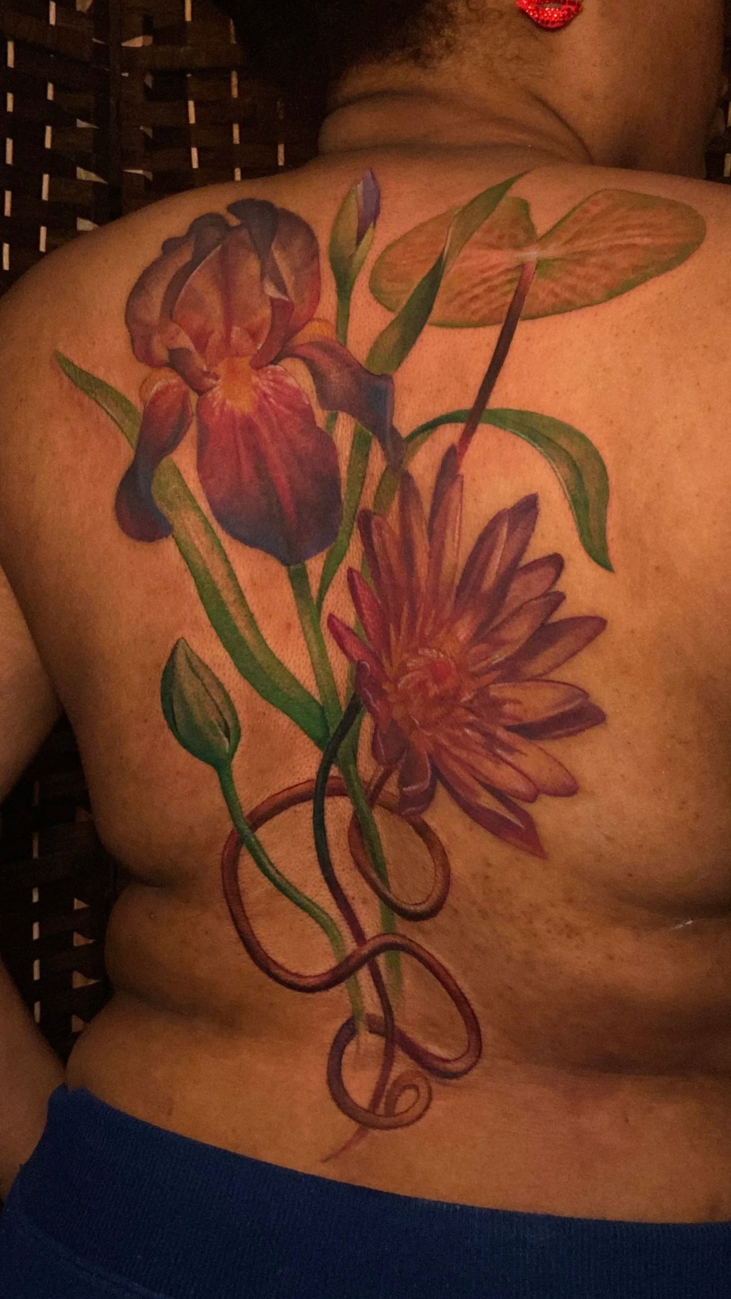 Adriana-hallow-tattoo-Melanated-skin-color-realism-nyc-lotus-iris-back-piece.png