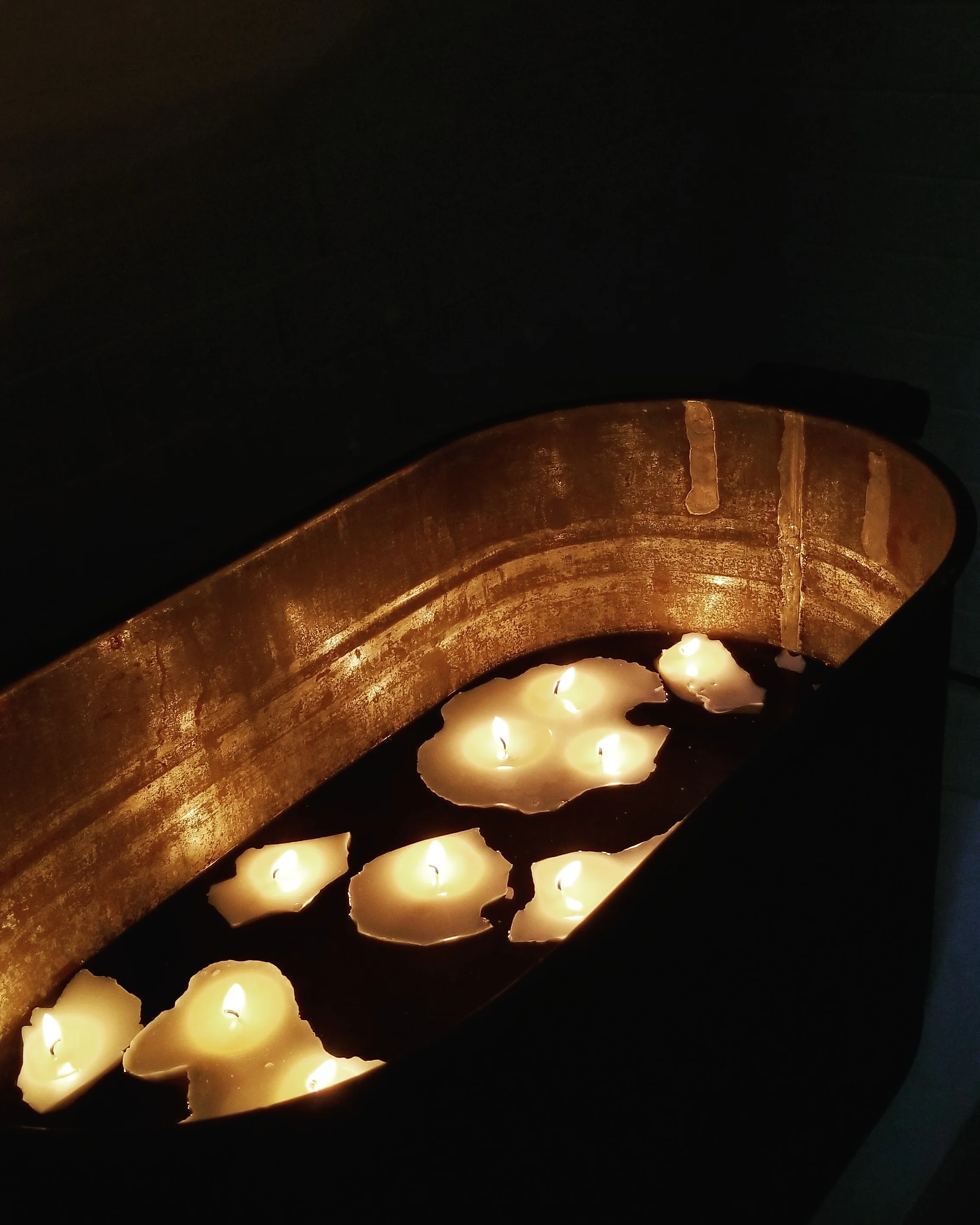 untitled (melting icebergs), 2018. handmade candles, water and washtub