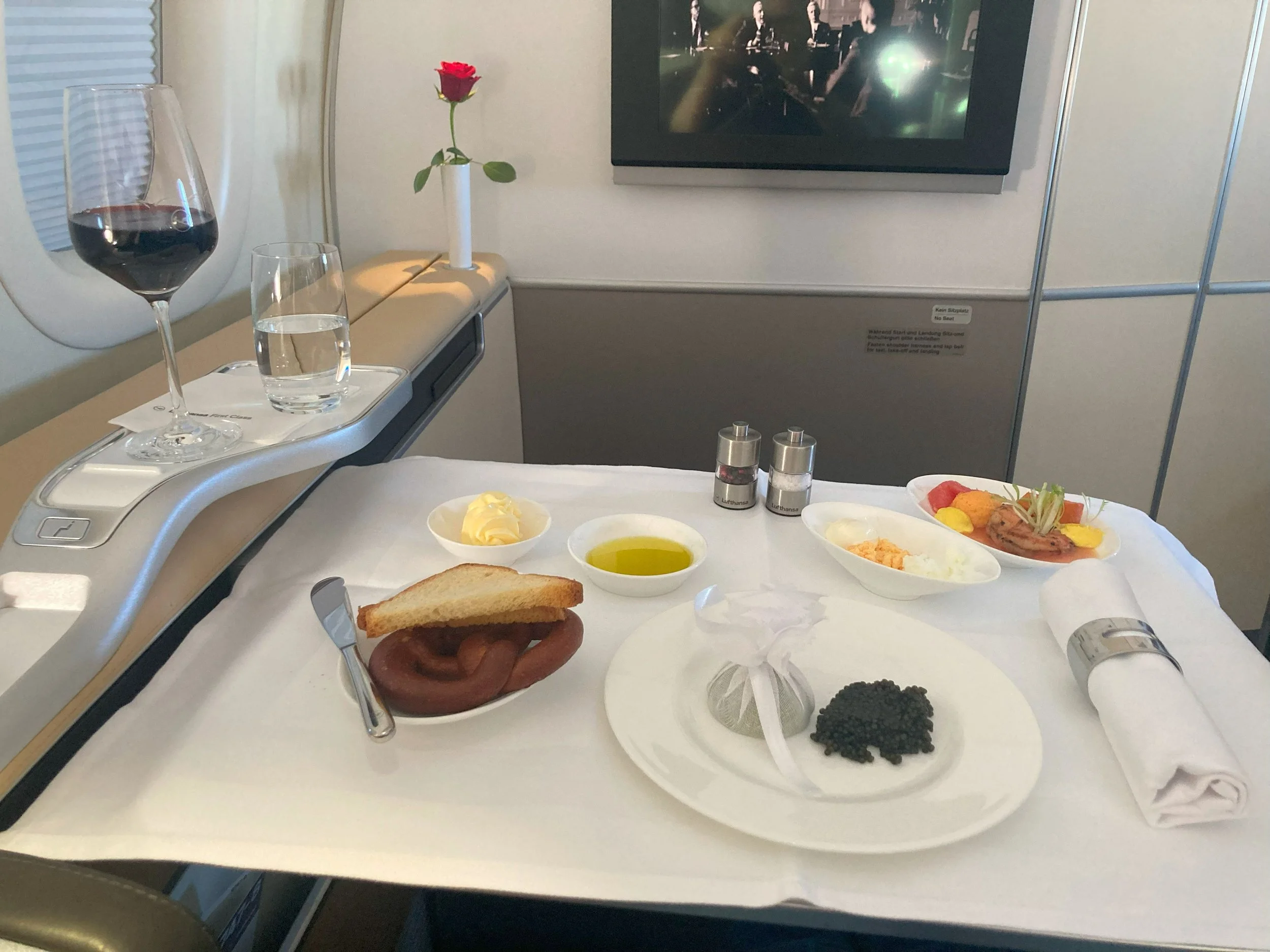 Caviar service to begin the main meal with LH's signature First Class rose at each seat 
