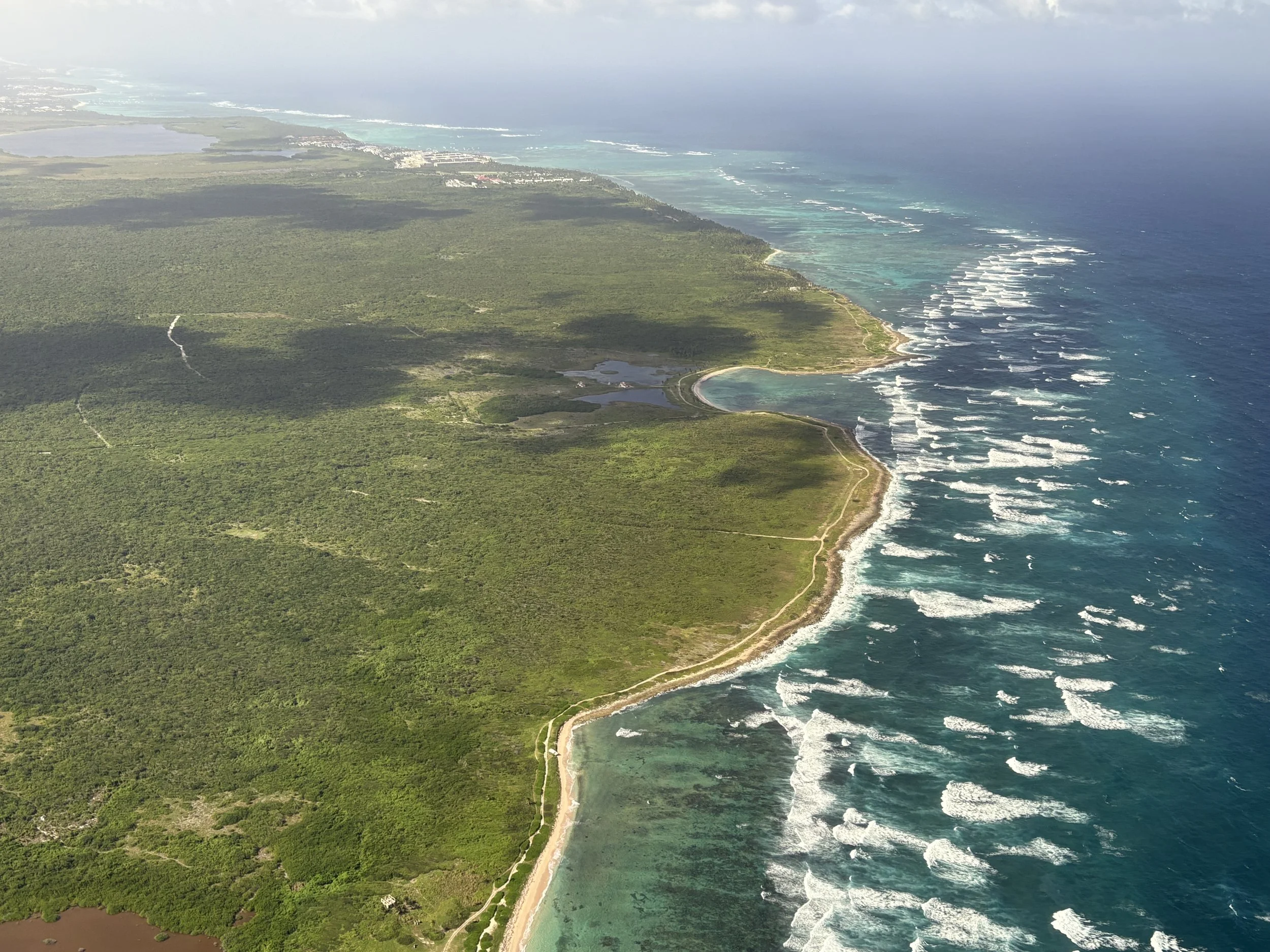  Catching our last view of the Dominican Republic on our plane’s climb out of Punta Cana 