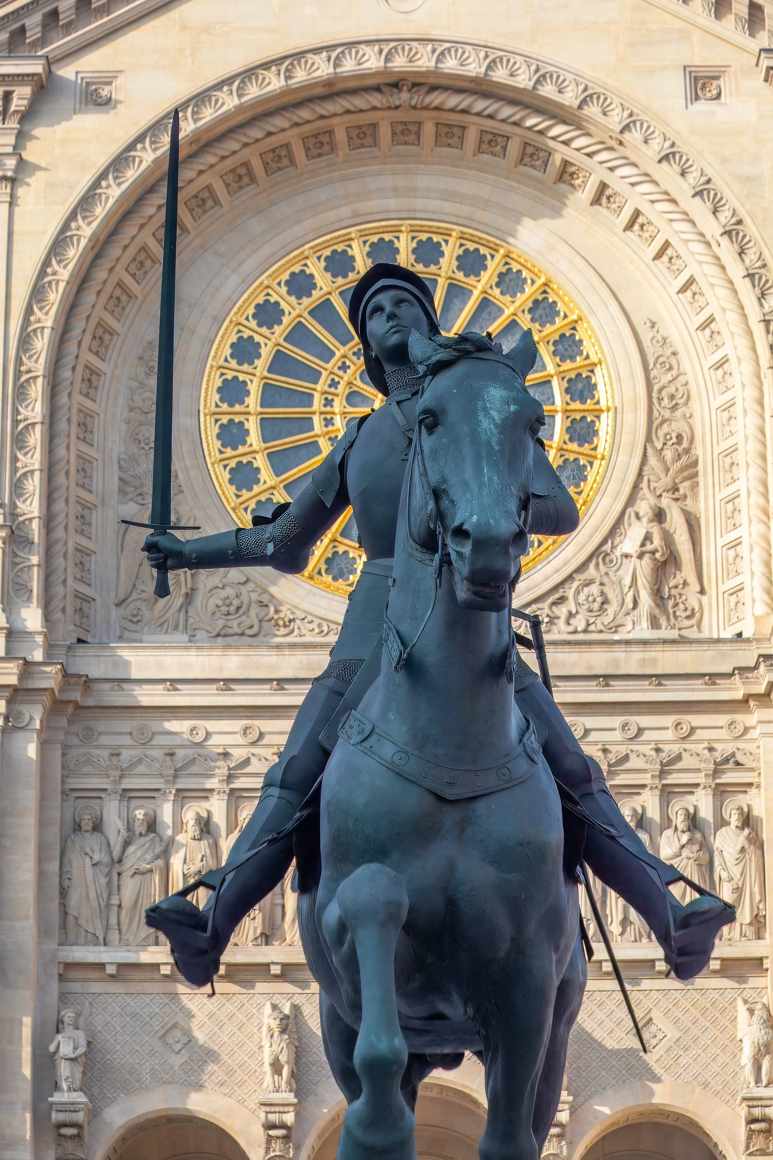  Statue of Joan of Arc on a Horse guards the church entrance 