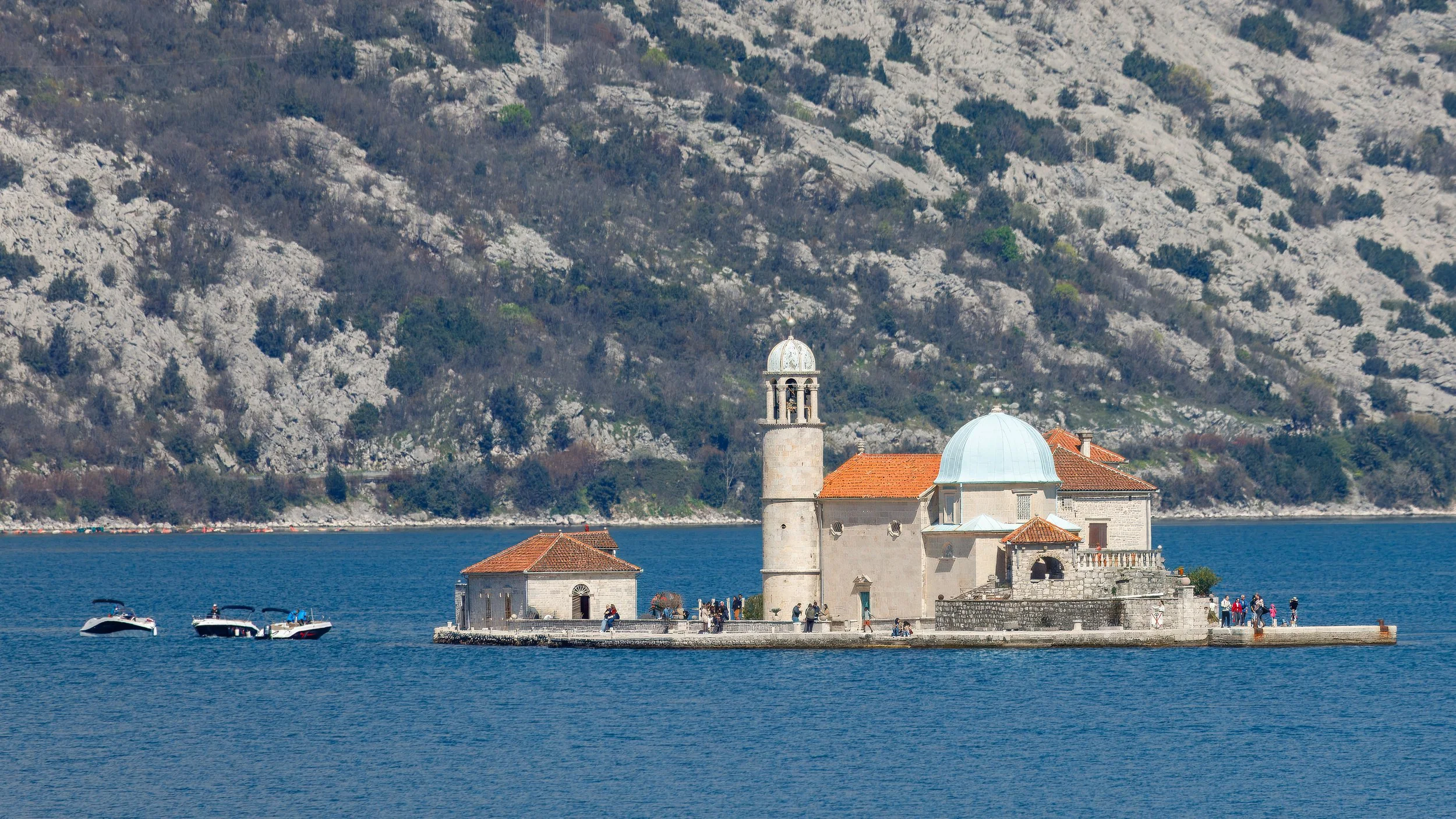  On the opposite side of the bay, now looking across to the Our Ladies of the Rock Catholic church with Perast in the background 
