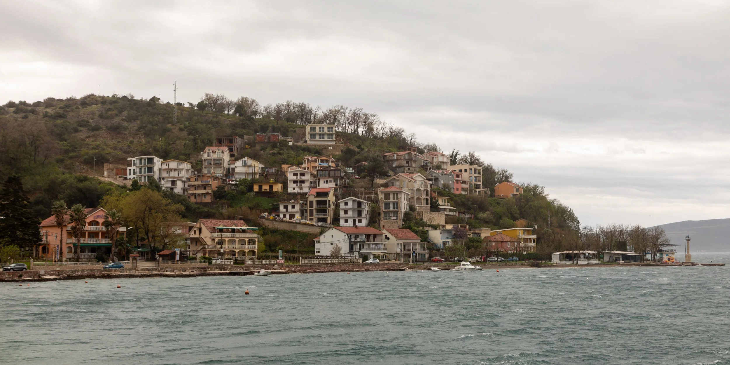  Heading south, we drove past the ferry we took the day before, and took a photo across the Verige Channel to the town of Kamenari 