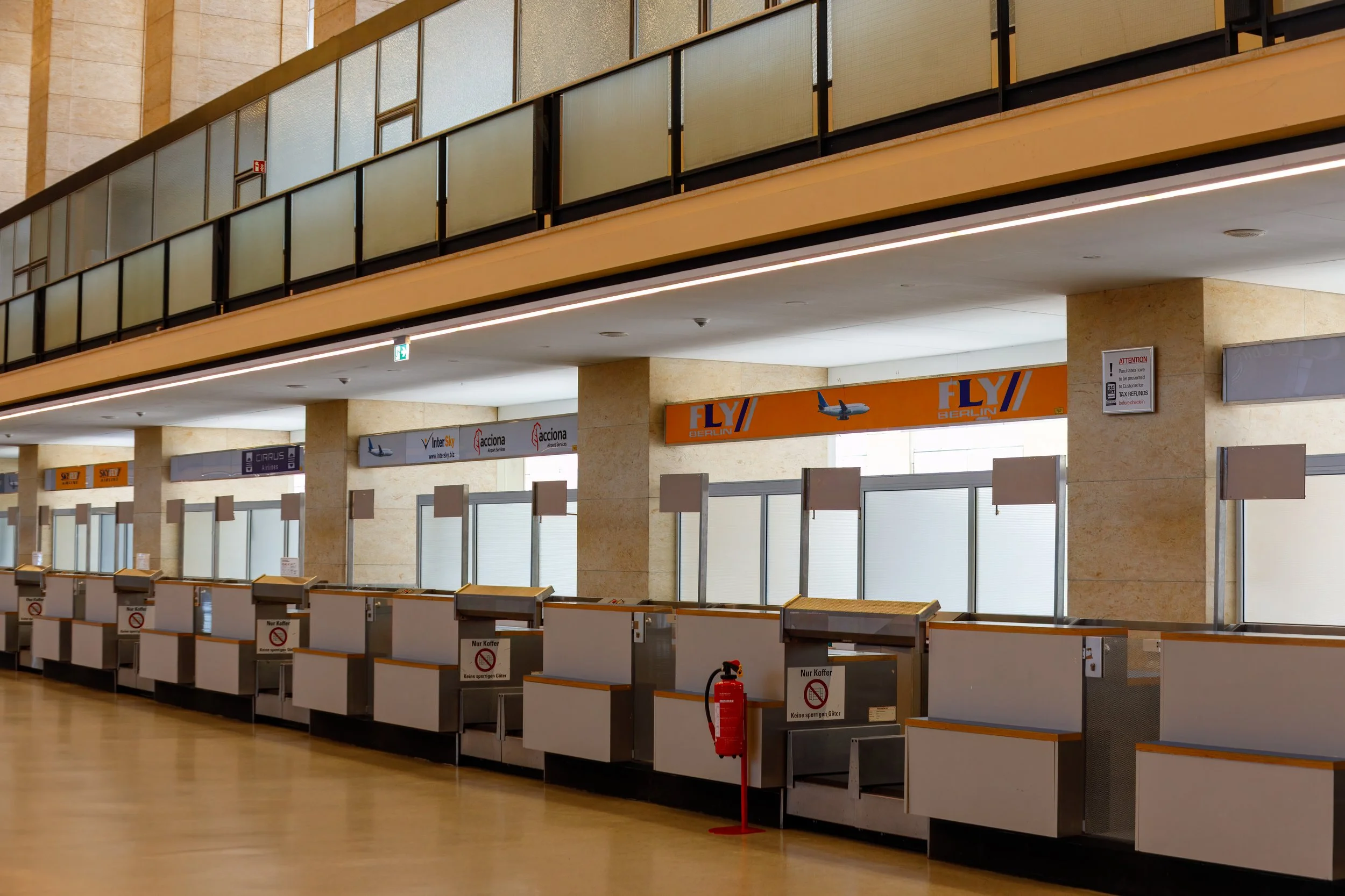  Very retro style check-in desks with some of the old airline logos 