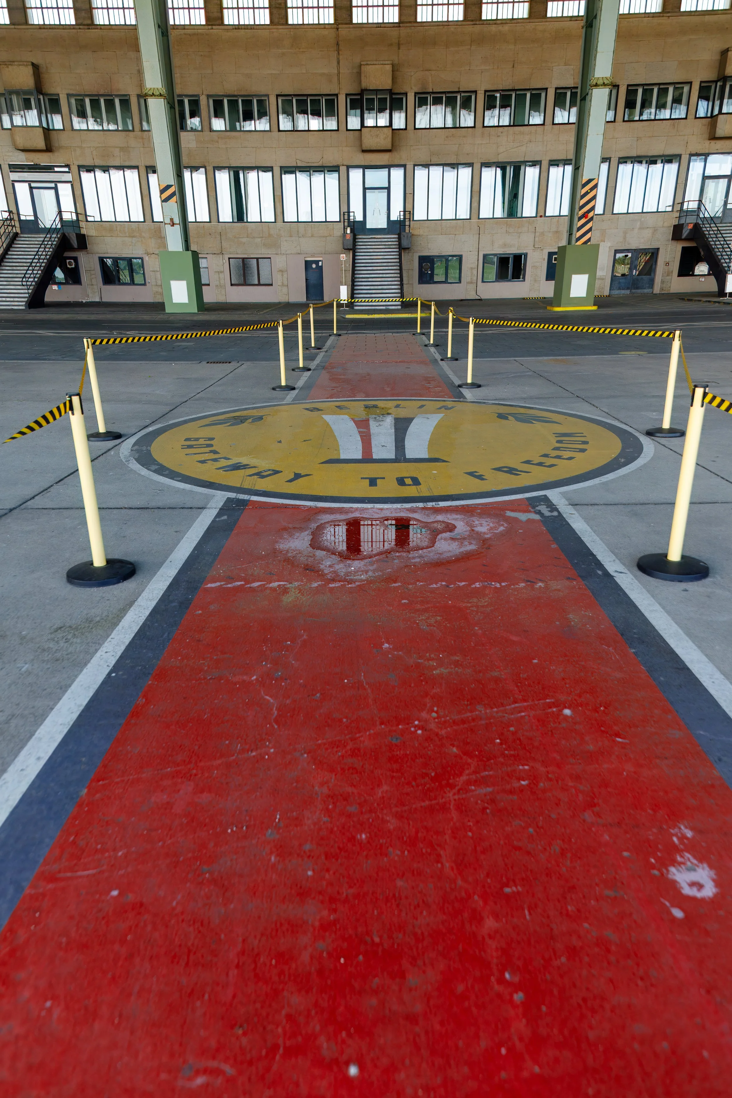 Painted carpet and airport logo leads to the terminal 