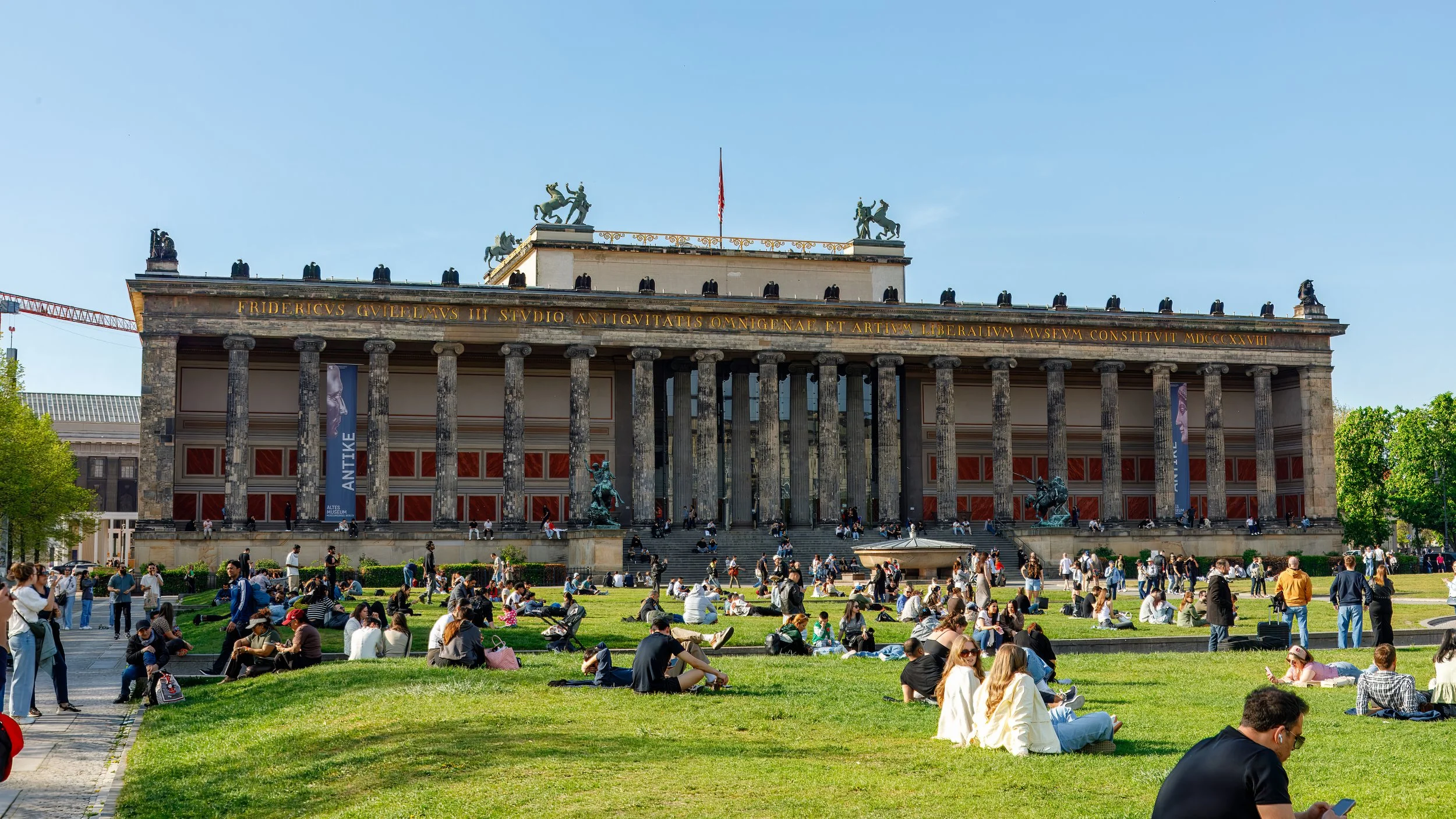  Locals enjoying the warm spring day in front of the Altes (old) Museum  