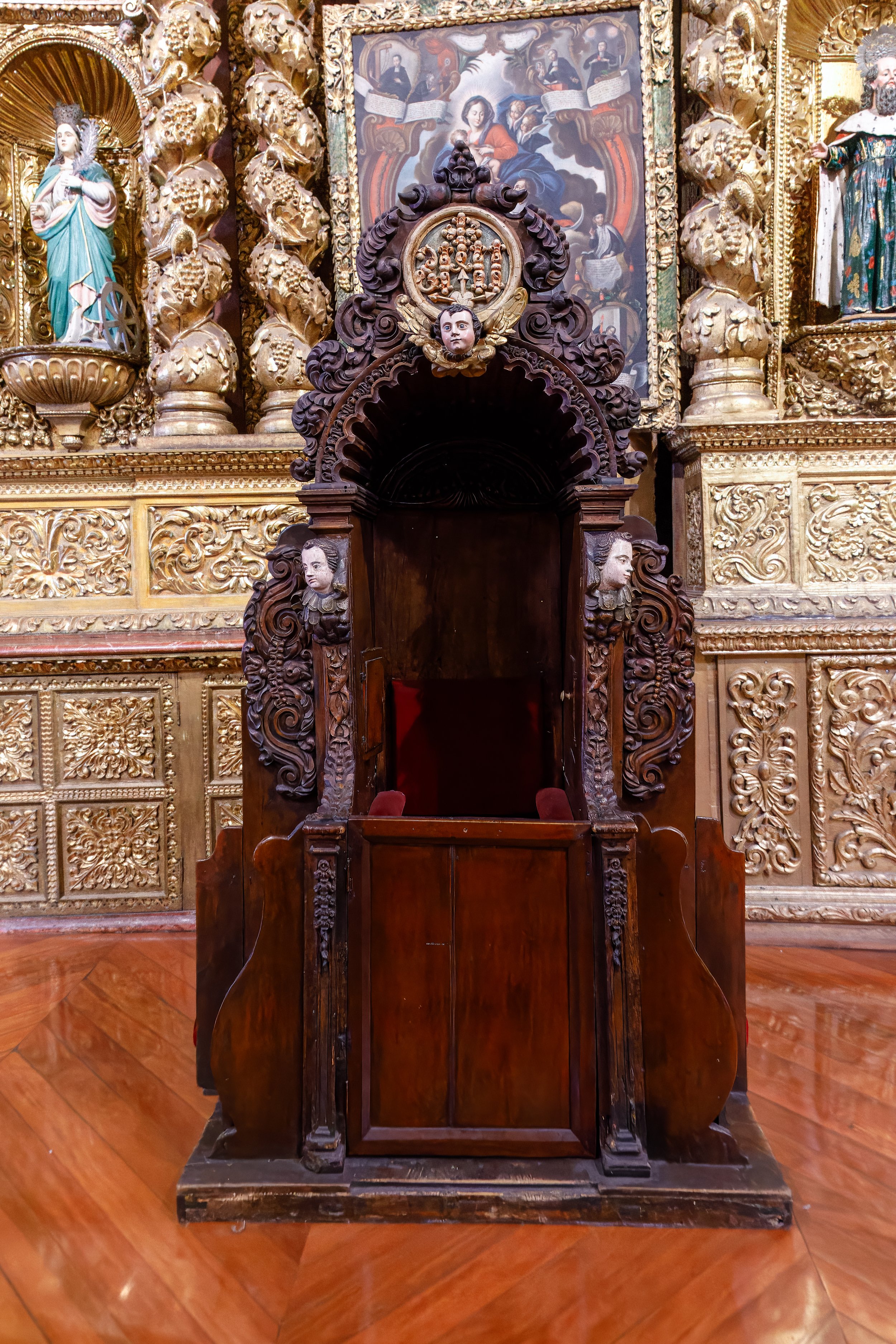  Carved wooden confessional inside the church 