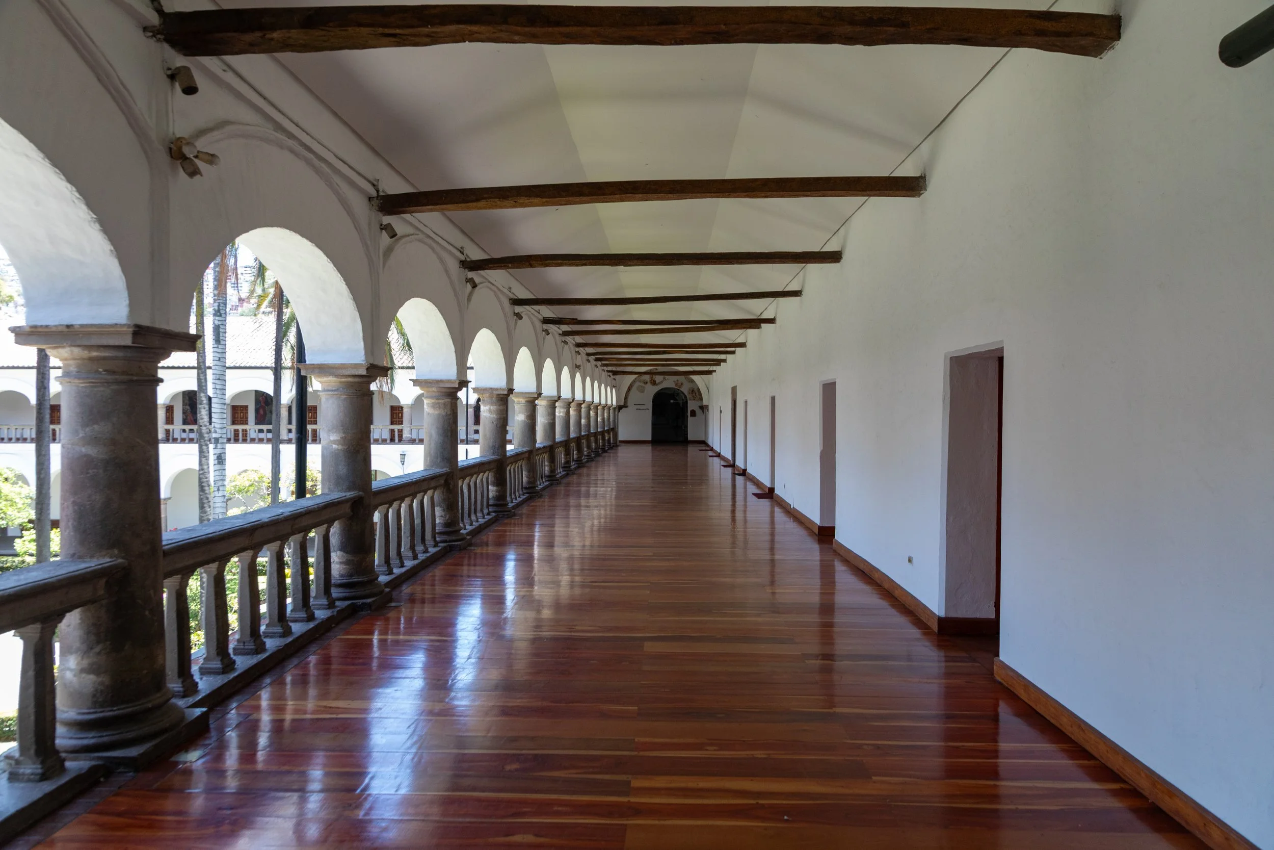  Impressive wood floor on of the exterior covered corridors  