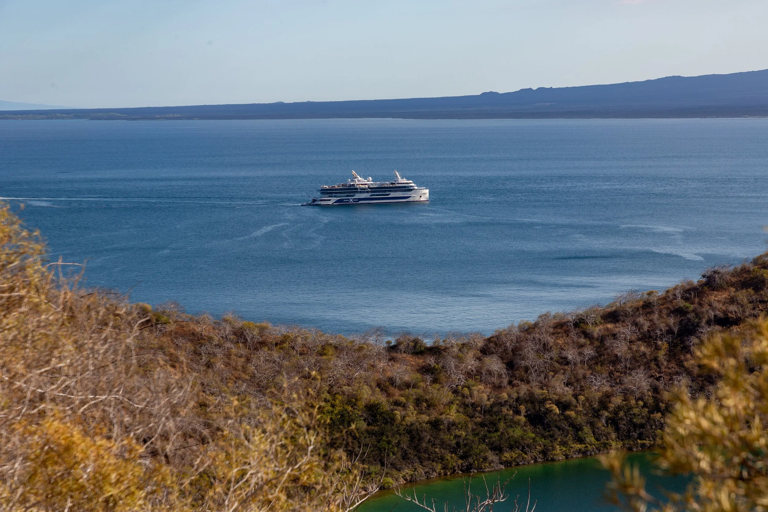  Our payoff from our fast-paced hike to the viewpoint was the view of the ship with Fernandina Island in the background 