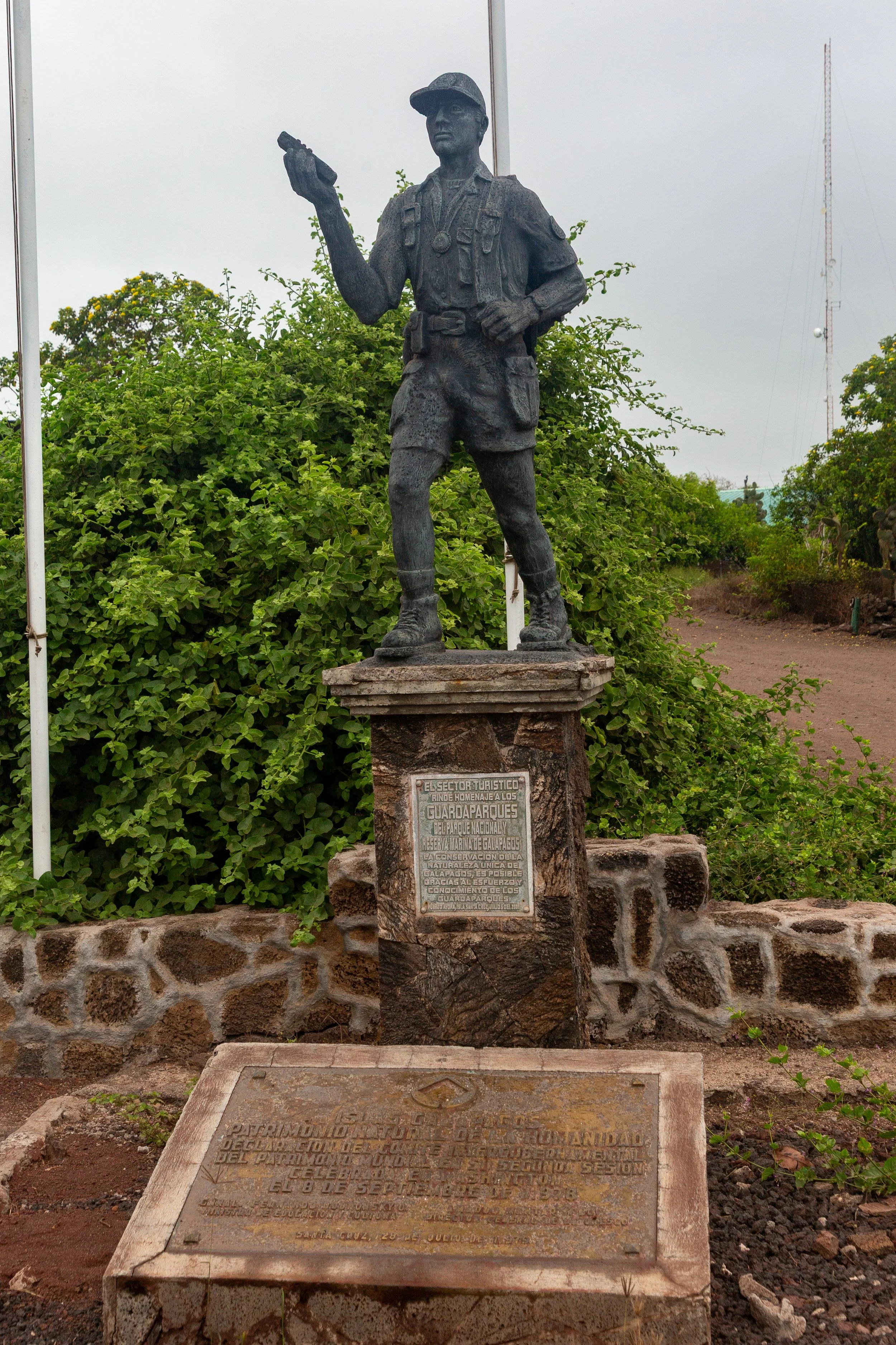  Statue of a park ranger, recognizing their hard work and role in tourism, in addition to a plaque acknowledging the “Islas Galapagos” as a UNESCO World Heritage Site 