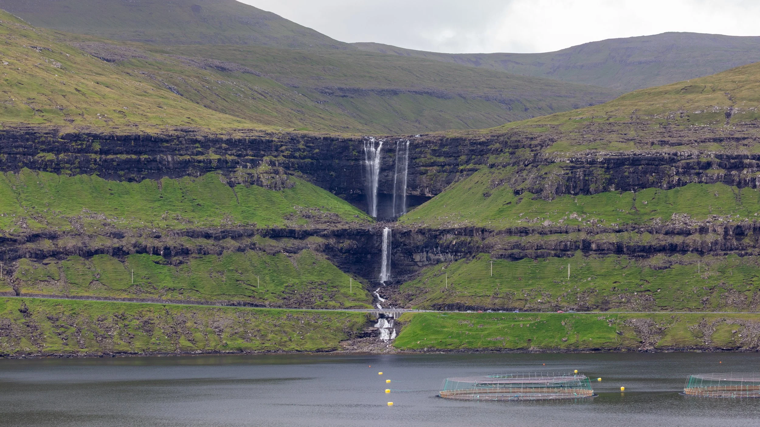  Moving on to the northwest coast of Eysturoy, we look across the strait to 140m Fossá waterfall, the tallest in the Faroe Islands on the island of Streymoy.&nbsp; 