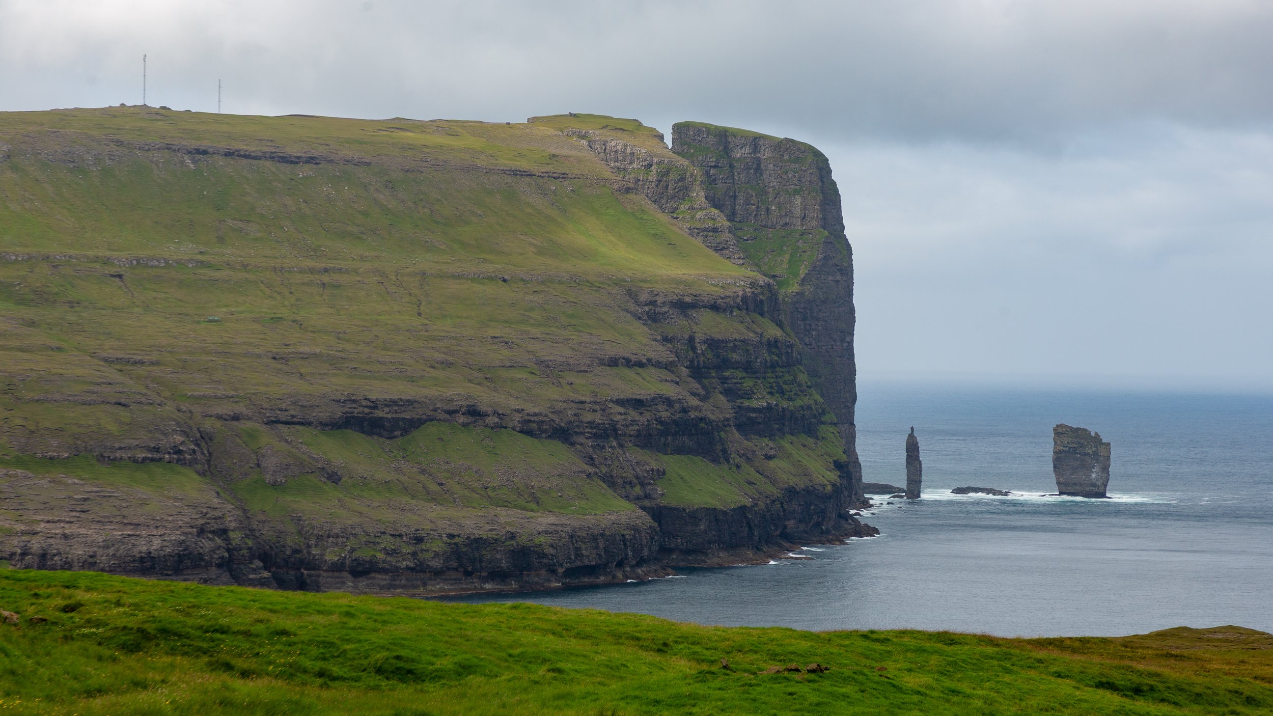  Looking back at Risin og Kellingin (The Giant and the Witch) sea stacks off the coast of Eysturoy 