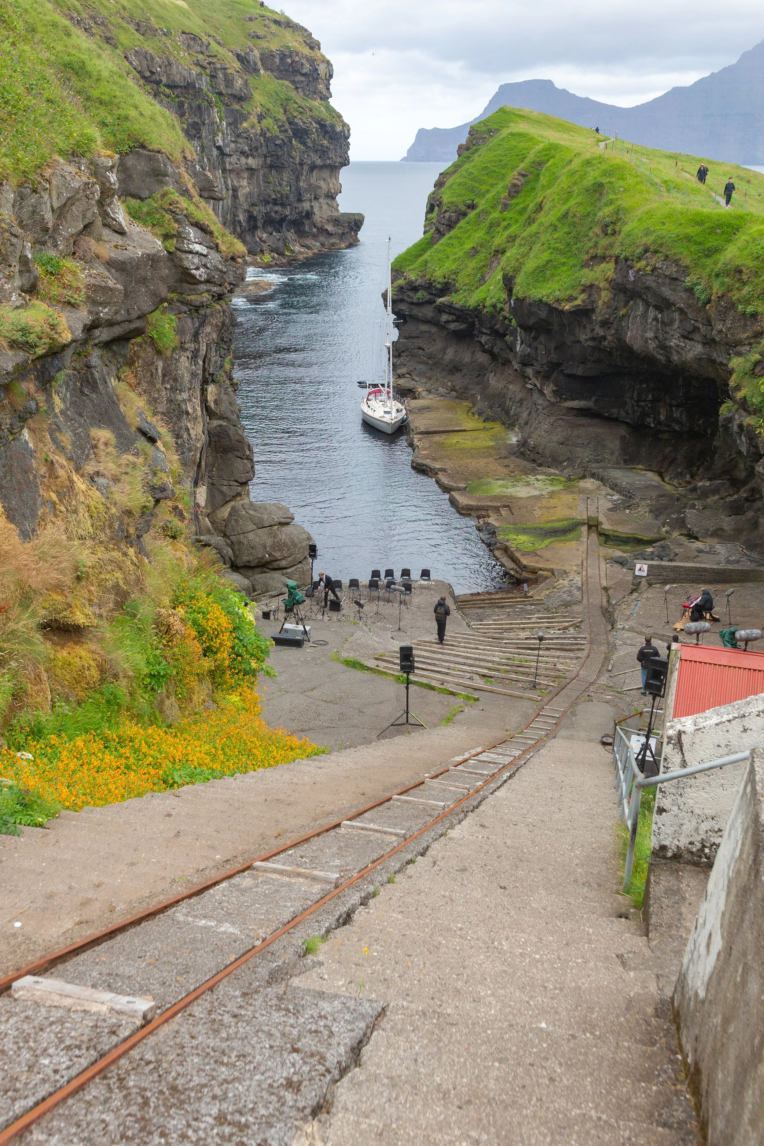  Gjógv natural harbour, where the town is starting to get set up for an outdoor concert that eventually filled the town with visitors 