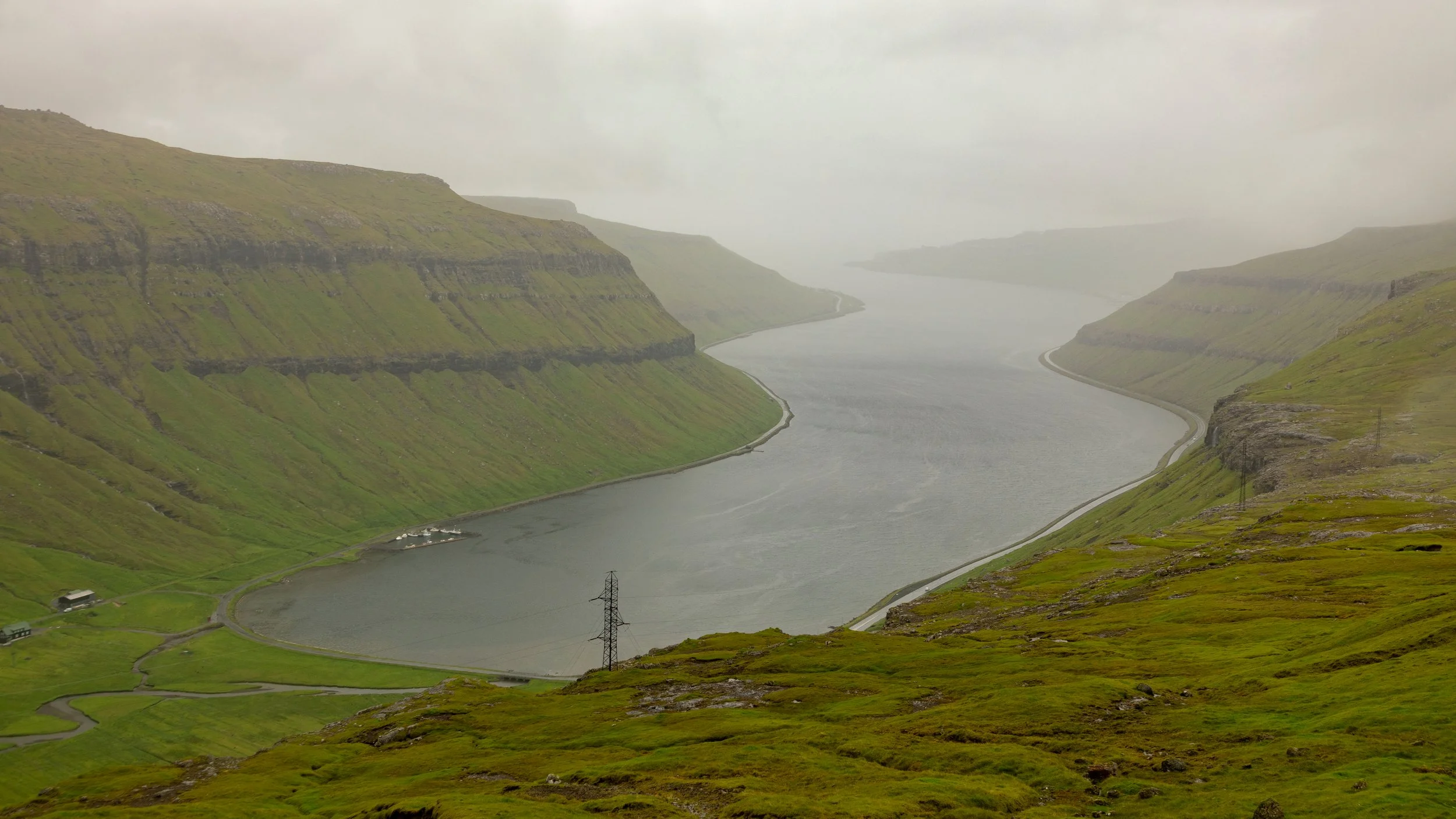  Although it was raining, we decided to take the original road over the mountain rather than the tunnel through, and looked down on the new road along the fjord we normally drove along 