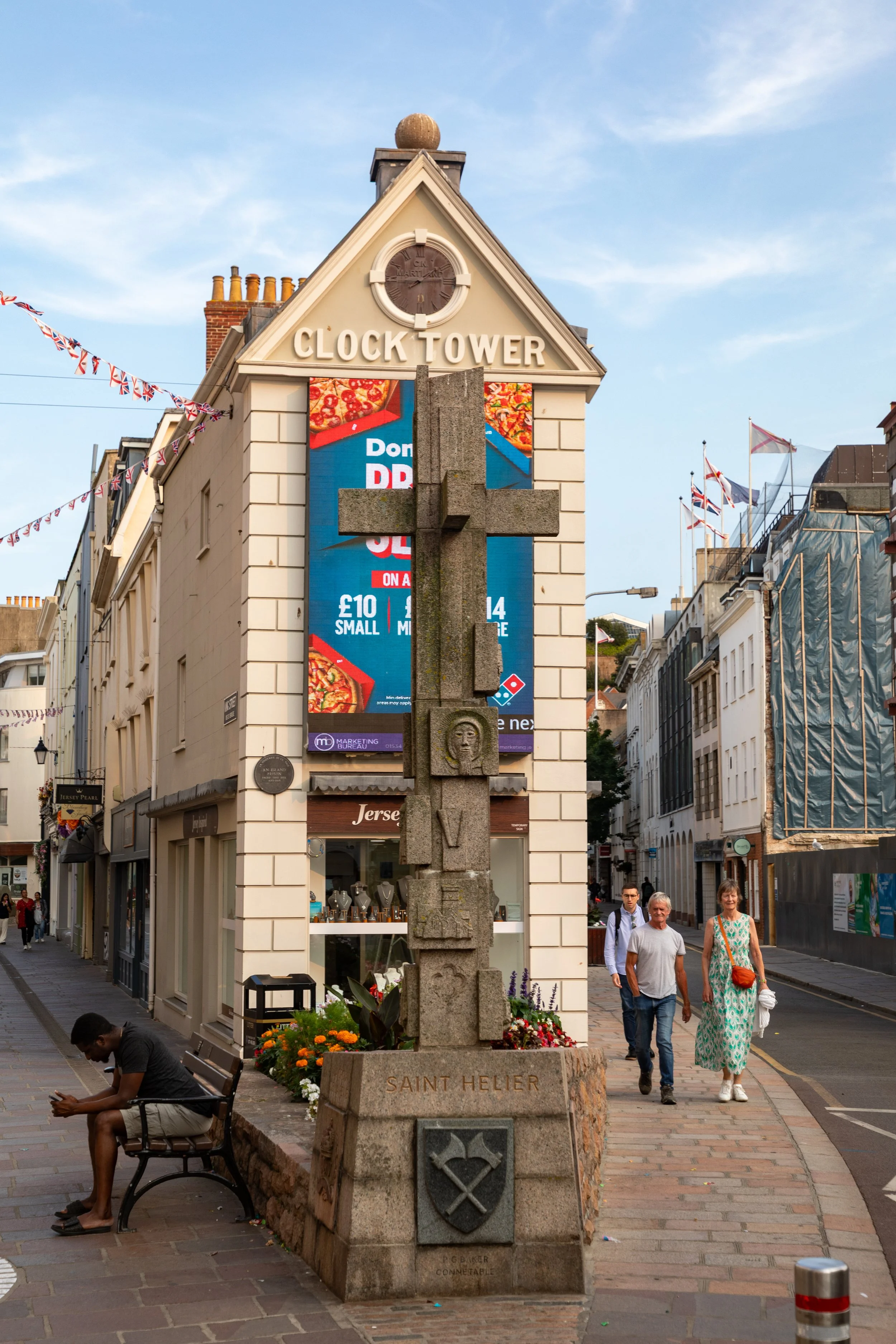 Back in St. Helier for dinner, walking past the Clock Tower building and La Croix de la Reine (Silver Jubilee Cross), erected in 1977 to mark the Silver Jubilee of Queen Elizabeth II.&nbsp; 