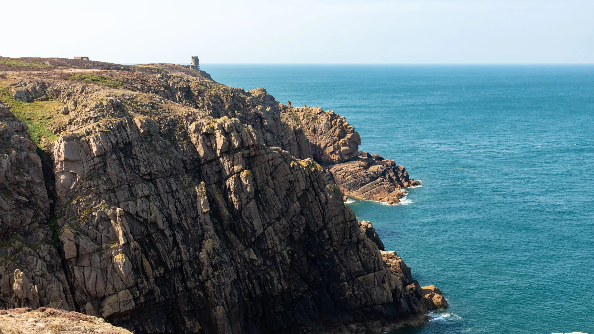  More of the rugged coast with another German observation tower in the background 