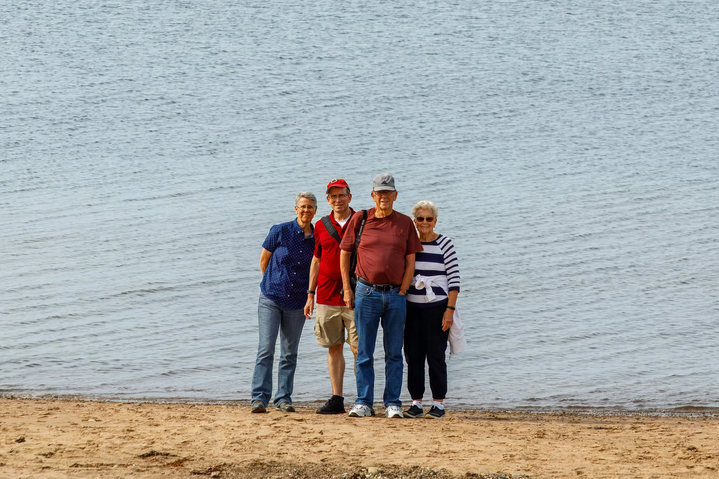  Pausing for a family photo along the beach 