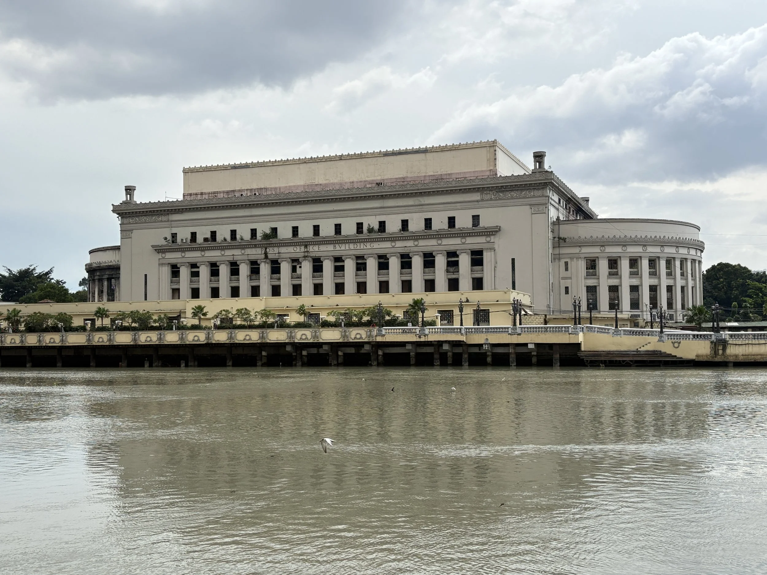  Back in central Manila, we decided to explore a different area.  This is Manila Central Post Office from across the Pasig River.&nbsp; 